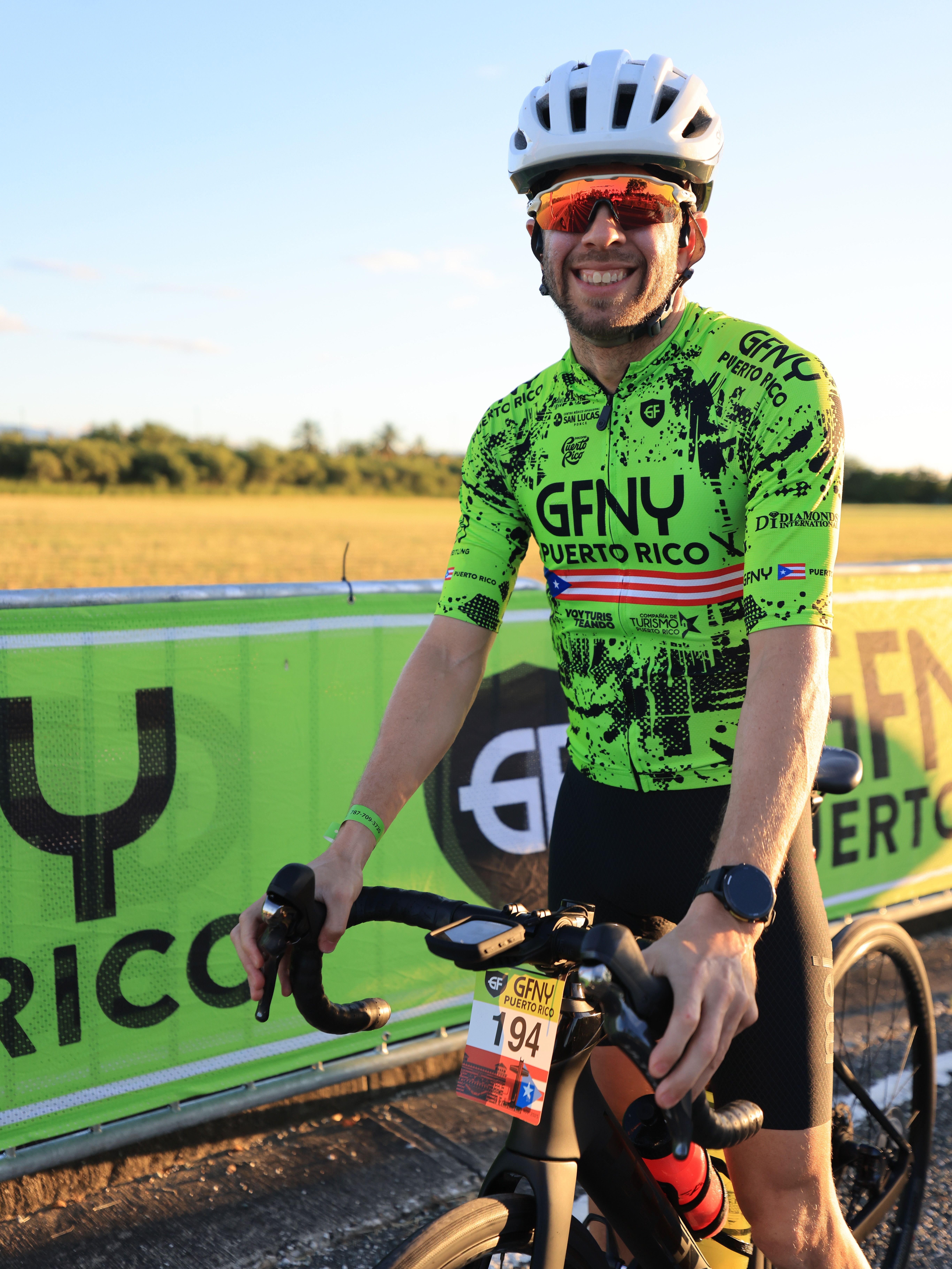 A cyclist participates in the GFNY Puerto Rico race event, showcasing endurance and sportsmanship.