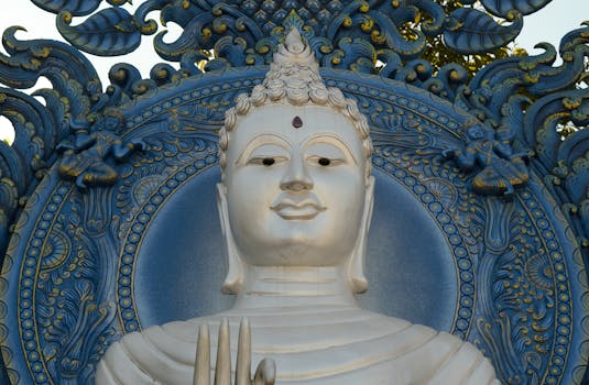 A stunning blue and white Buddha statue at Wat Rong Suea Ten in Chiang Rai, Thailand.