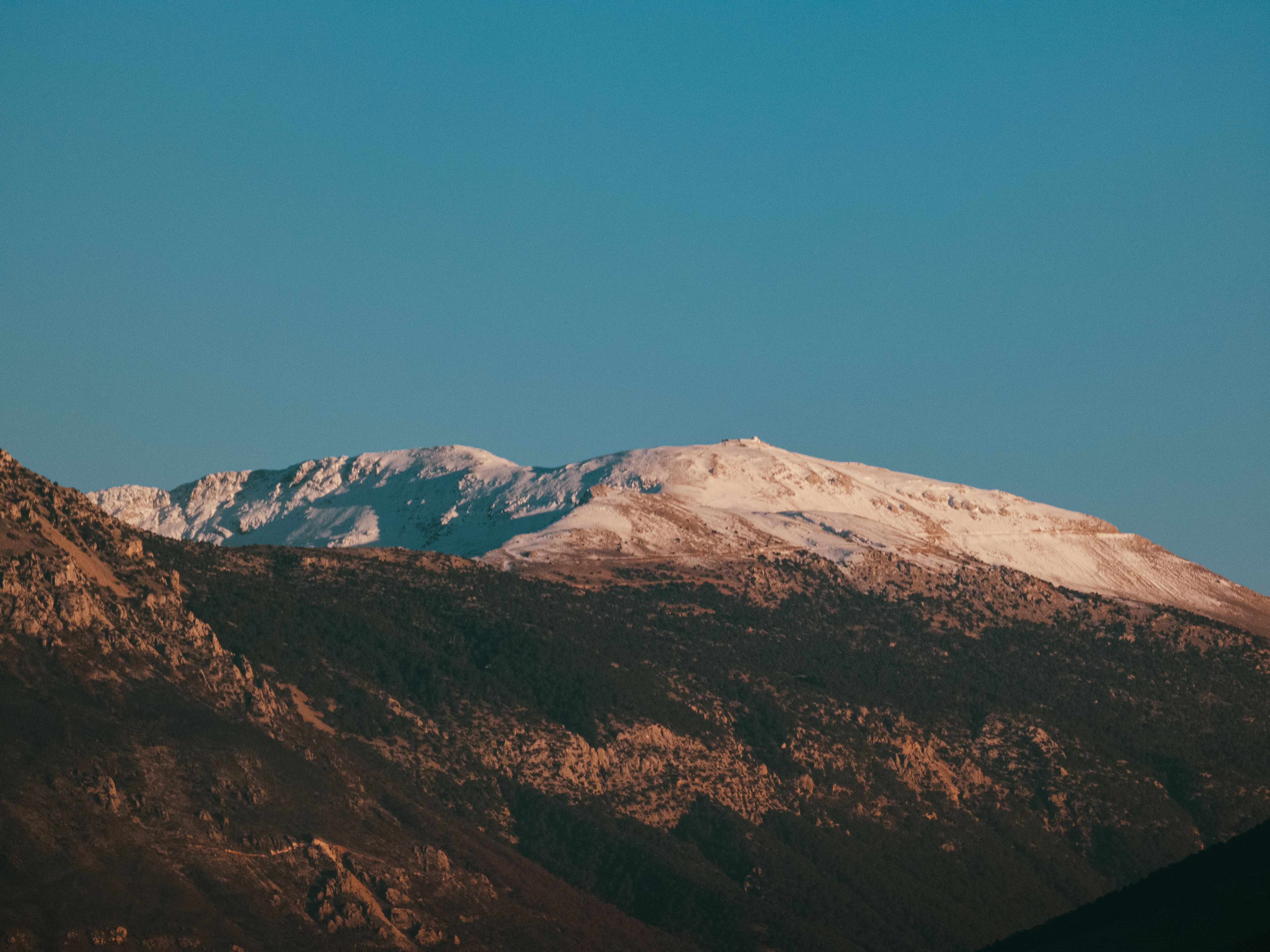 Snow-Capped Mountain Under Clear Blue Sky · Free Stock Photo