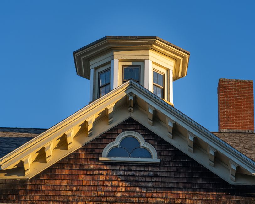 Elegant wooden cupola on a historic house.