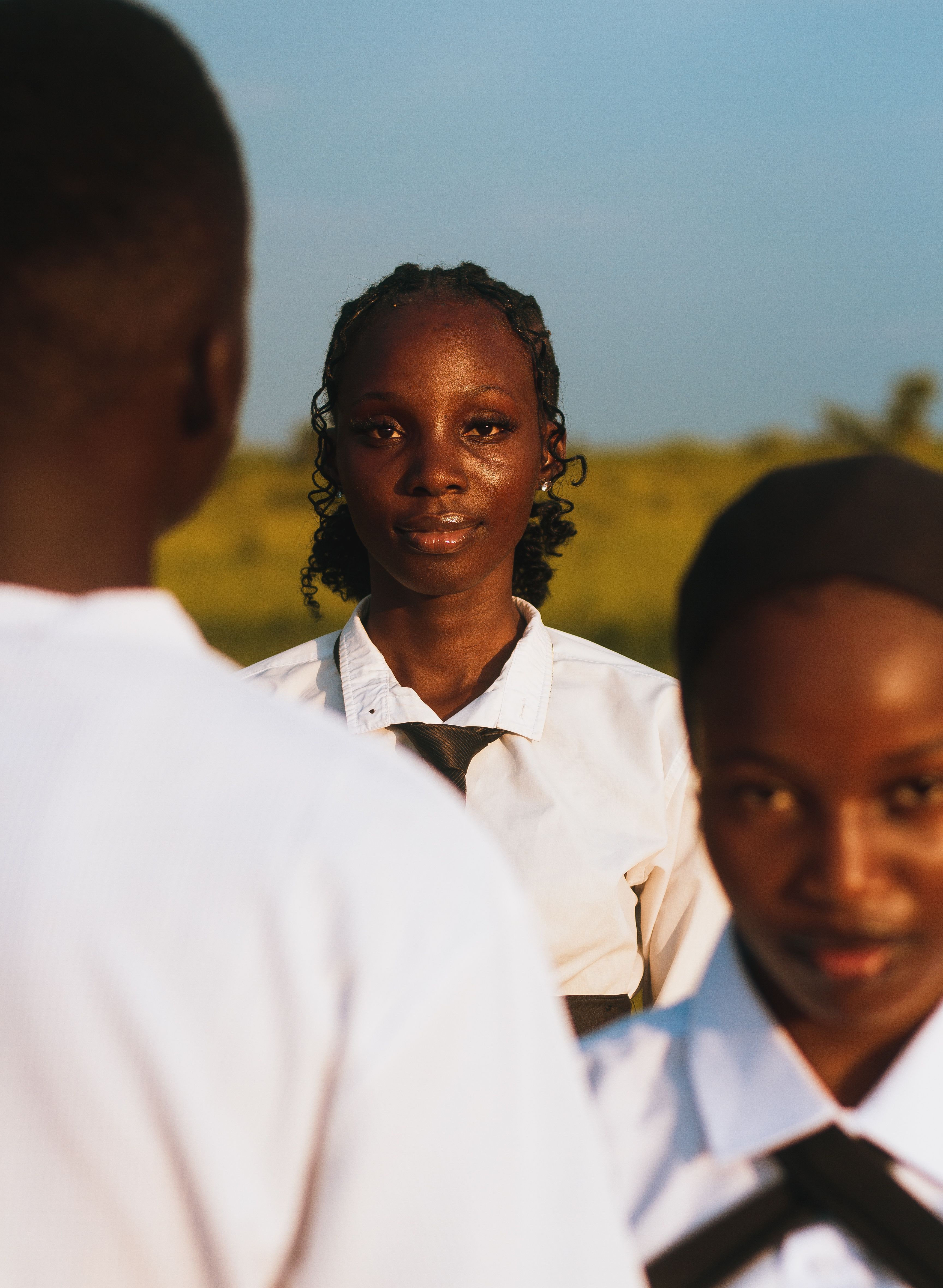 Nigerian students in school uniform studying outdoors