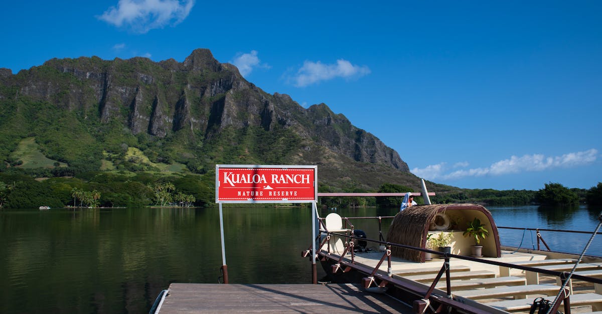 Photo by Trac Vu Beautiful view of Kualoa Ranch with majestic mountains and tranquil waters in Hawaii.