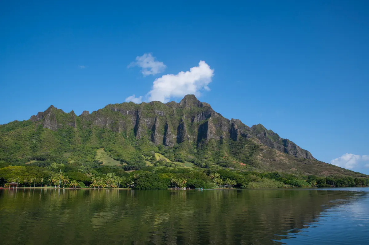 Misty green Koolau mountain range on Oahu under low cloud