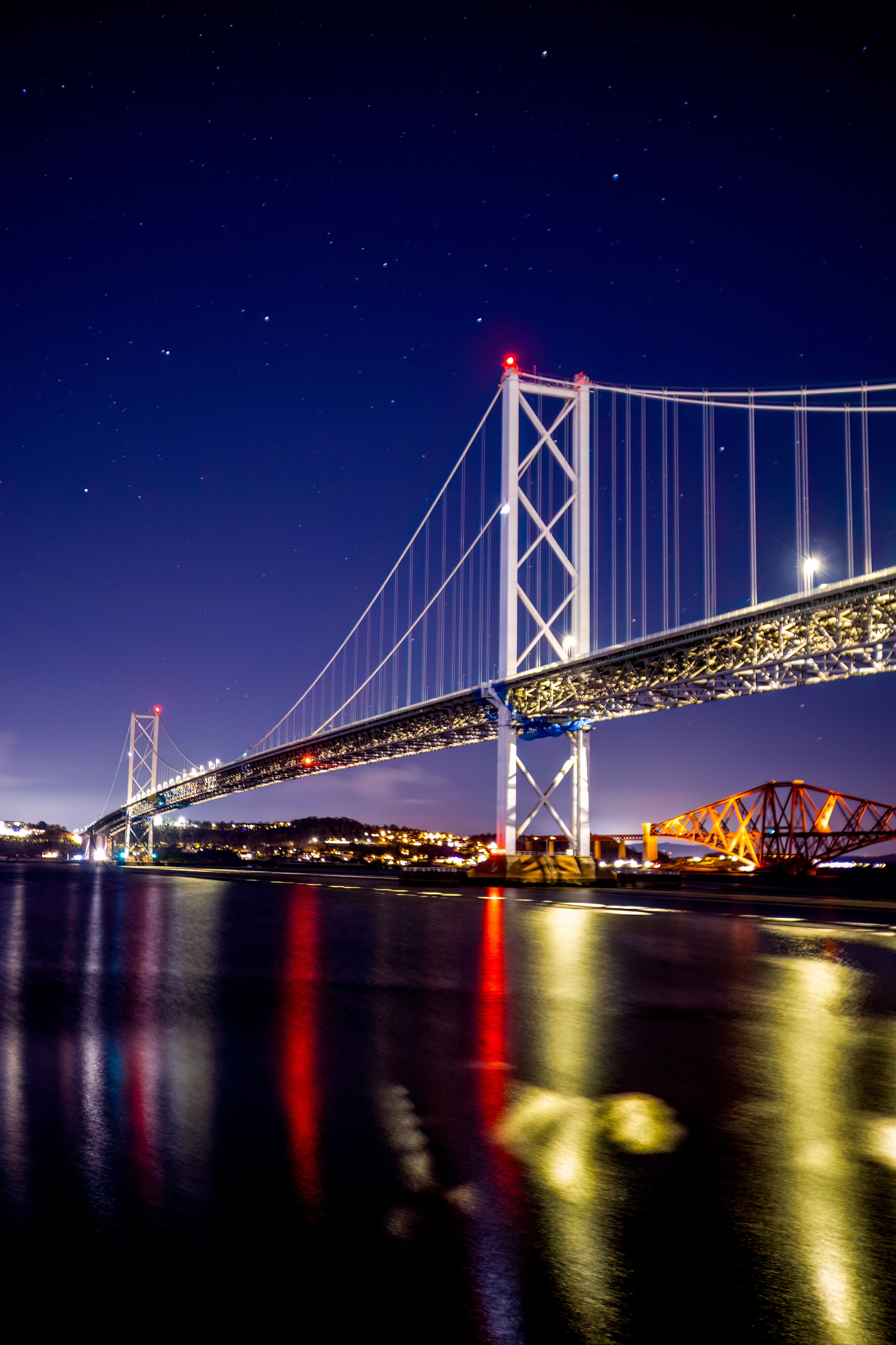 Stunning Night View of Forth Bridges Reflected in Water · Free Stock Photo