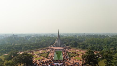 Free Aerial shot of Bangladesh National Martyrs' Memorial in Savar, surrounded by greenery and visitors. Stock Photo