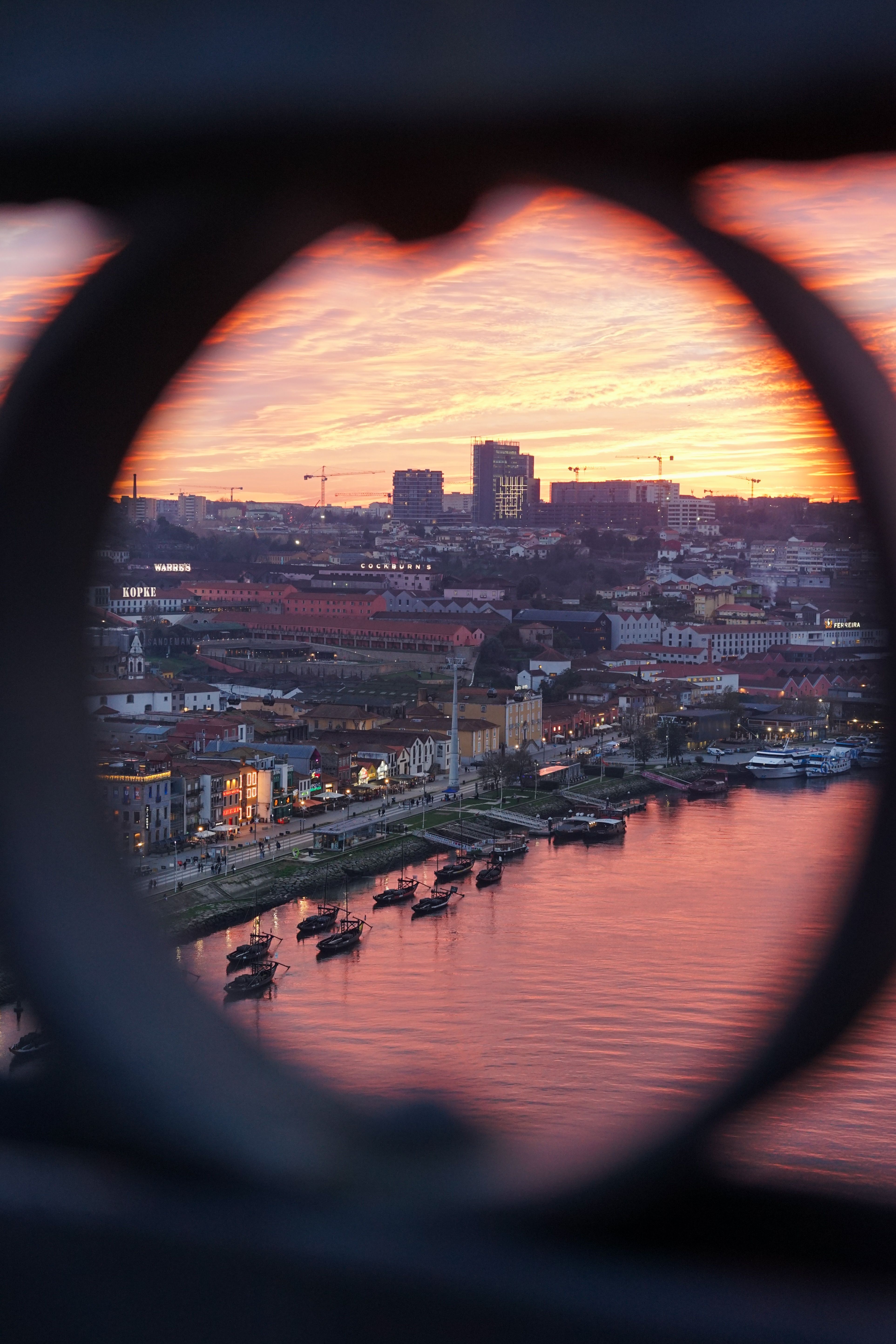 Scenic Riverside City at Vibrant Sunset · Free Stock Photo