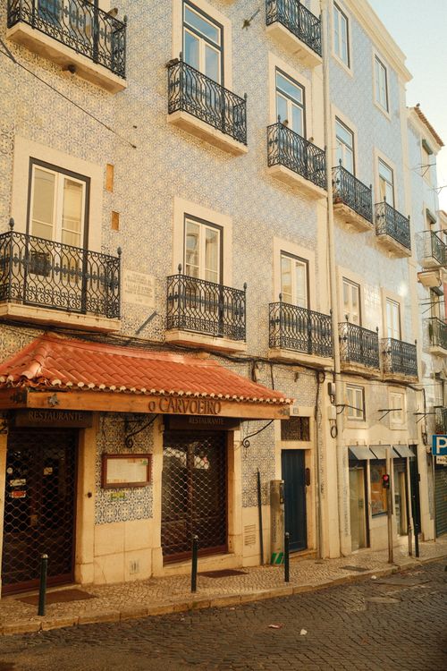 Free Beautiful Lisbon street scene with iconic azulejos and classic architecture, showcasing Portuguese charm. Stock Photo
