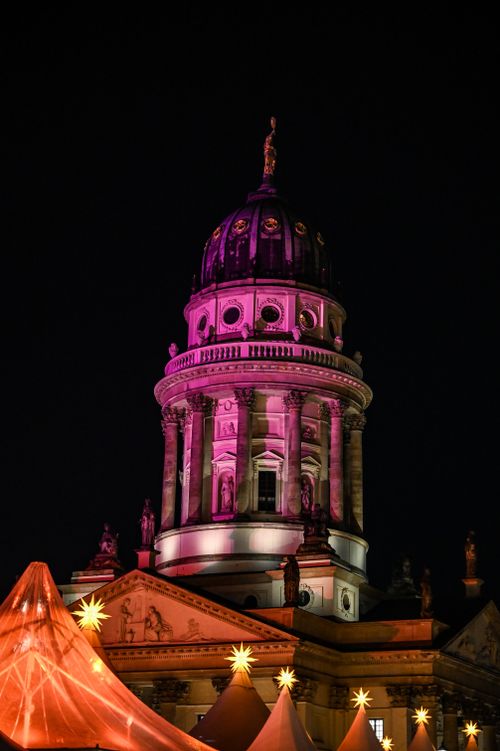 Free An iconic dome and beautifully lit tents creating a festive atmosphere at night. Stock Photo