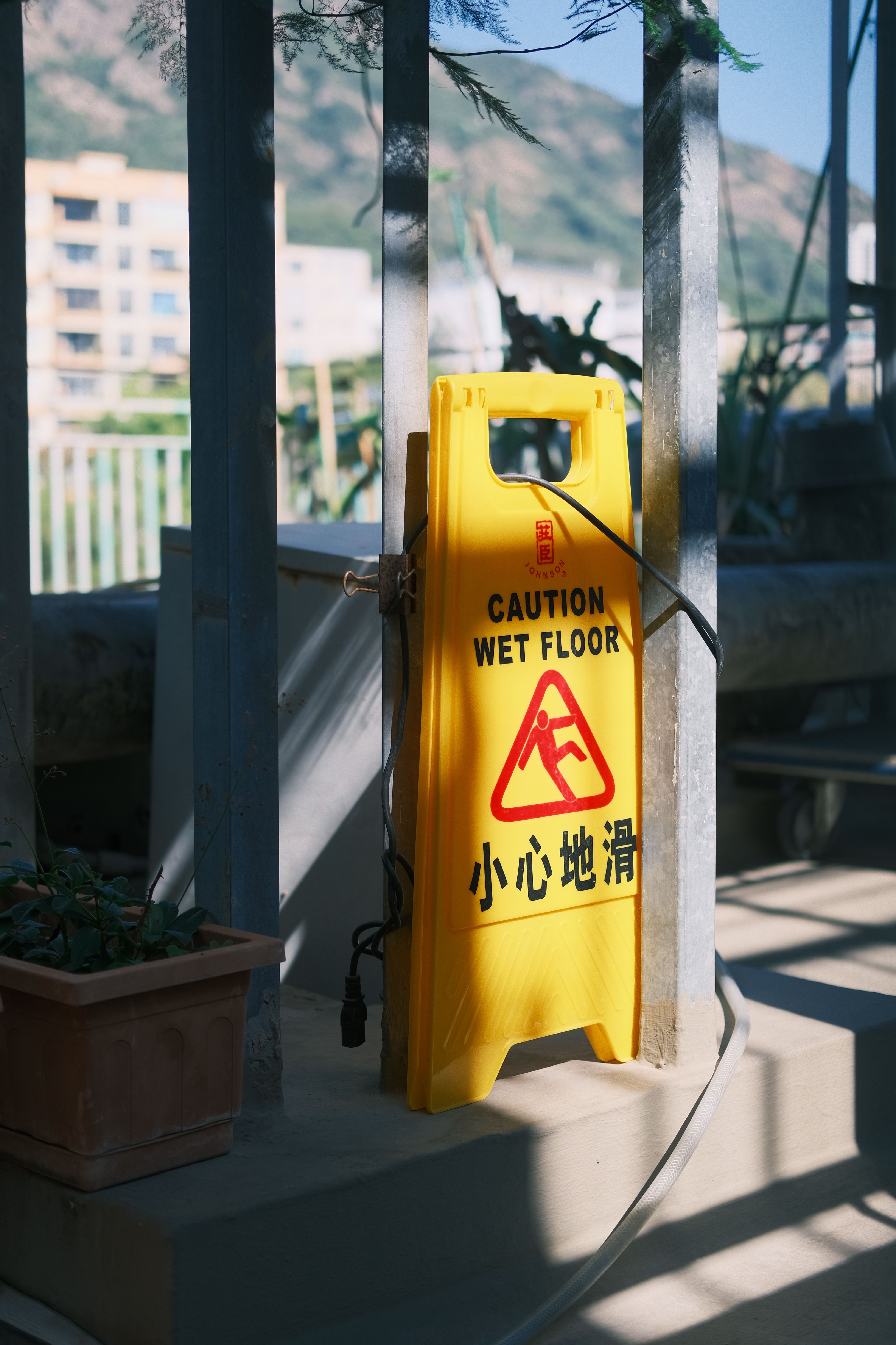 Warning Sign on Rooftop with Scenic Background · Free Stock Photo