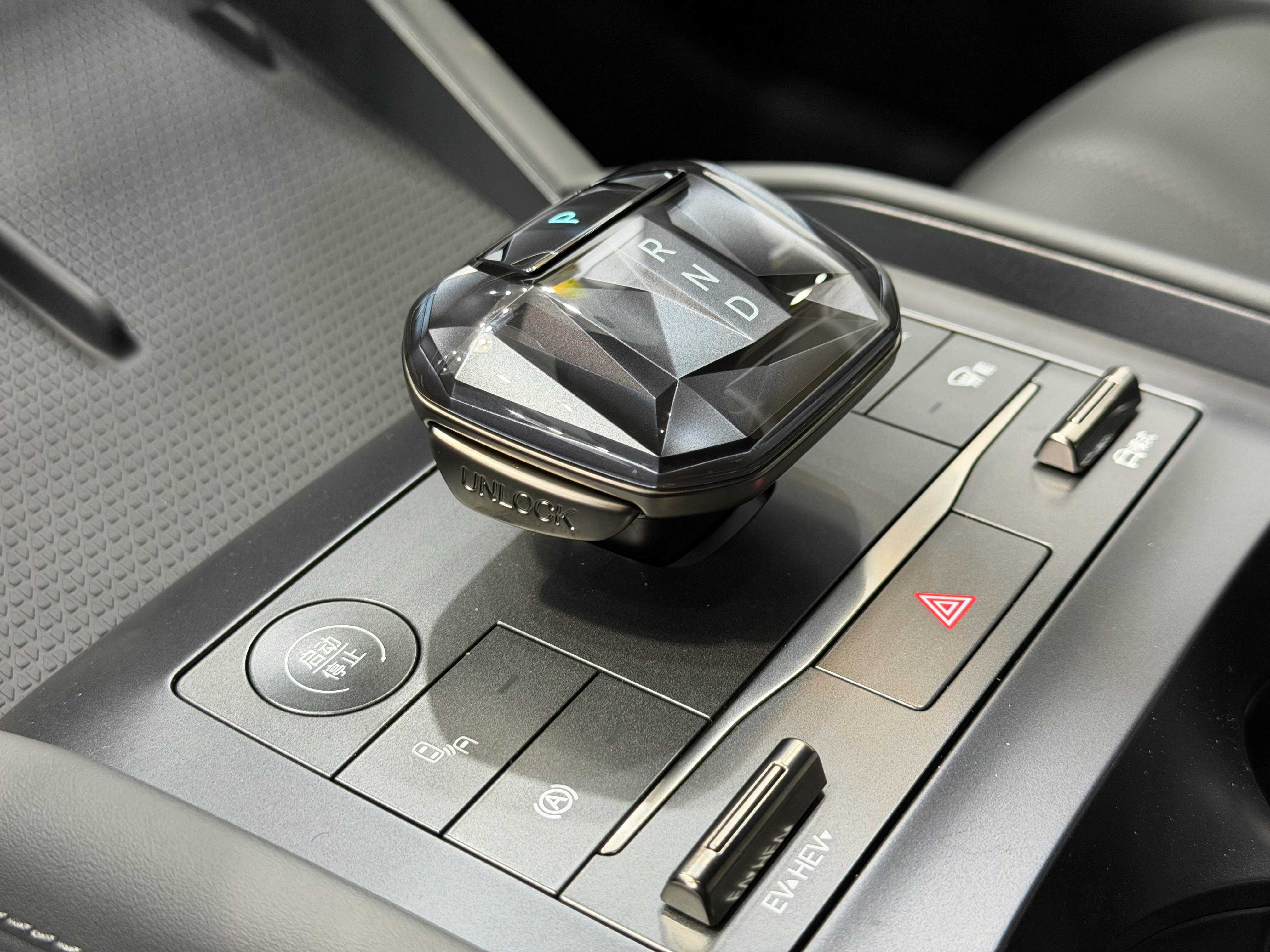 Free Close-up of a car's sophisticated gear shift with a sleek, modern design. Stock Photo