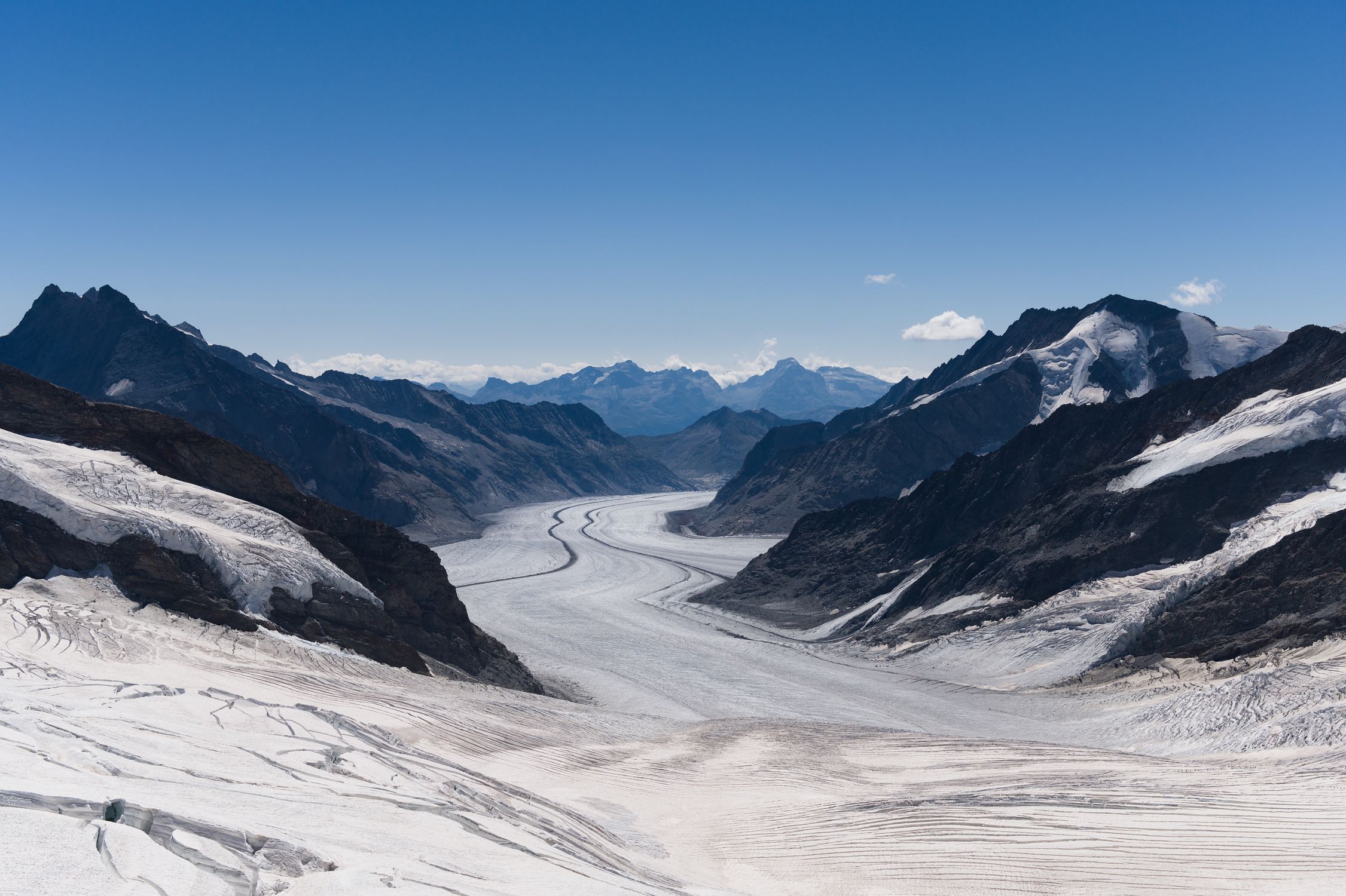 Panoramic view of the Aletsch Glacier framed by majestic Swiss Alpine peaks -- the largest glacier in the Alps