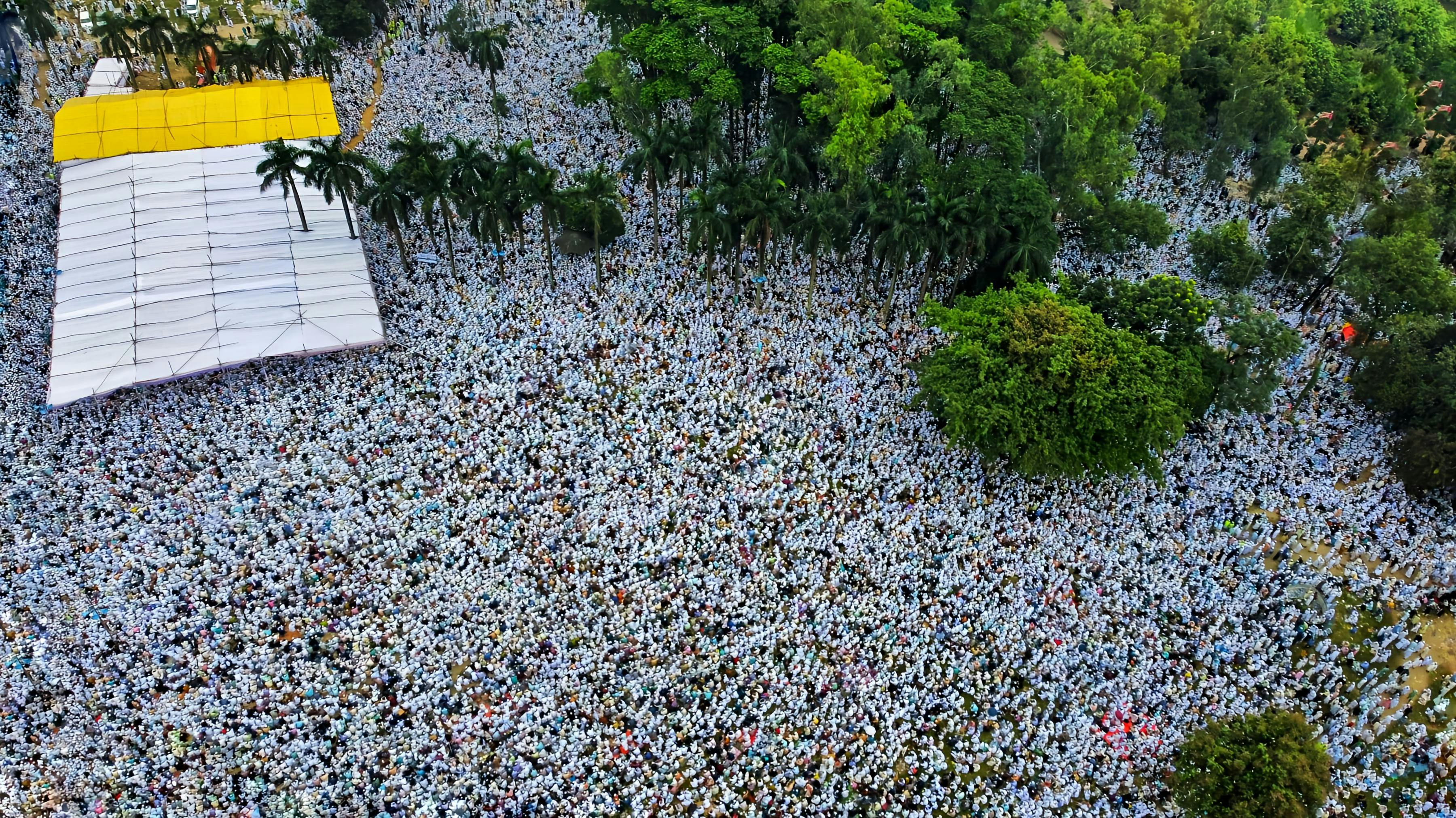 Christ Embassy Ho congregation gathering outdoors under trees, Volta Region