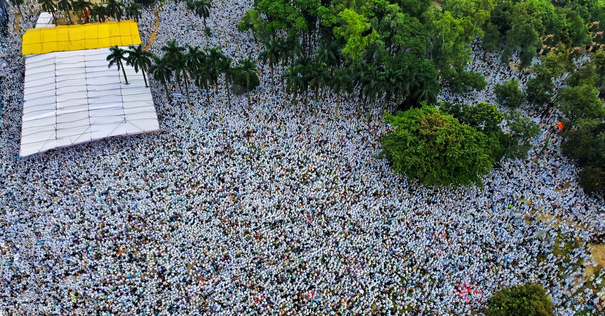 Christ Embassy Ho congregation gathering outdoors under trees, Volta Region