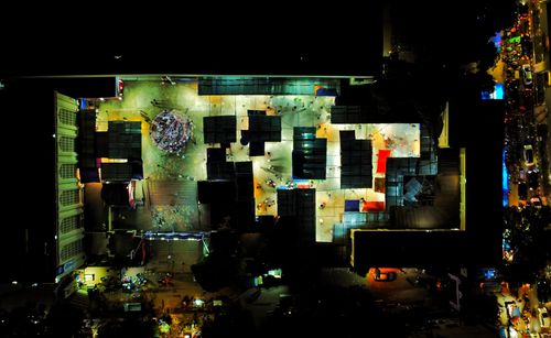 Free Illuminated aerial view of a vibrant marketplace in Dhaka, highlighting urban nightlife. Stock Photo