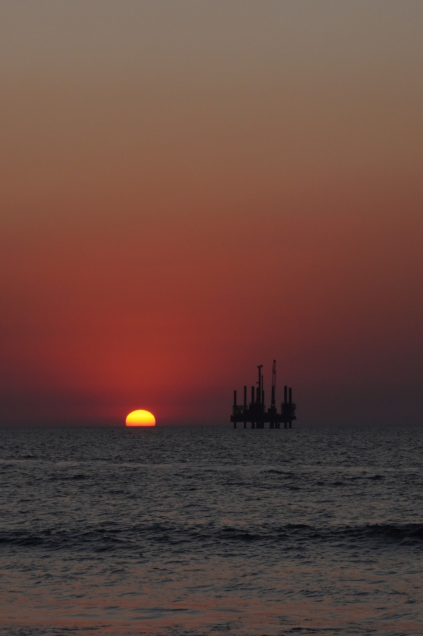 Silhouettes of Ships at Sea During Sunset · Free Stock Photo