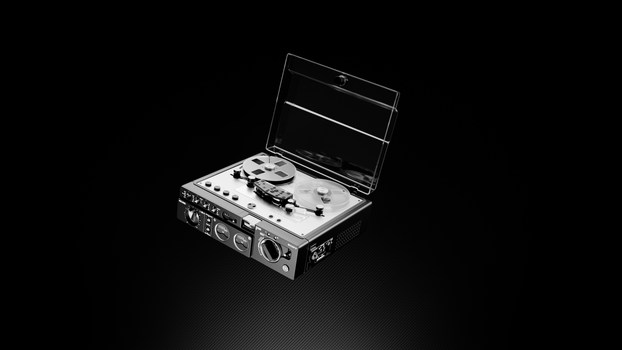 High-contrast image of a vintage reel-to-reel tape recorder against a dark background.