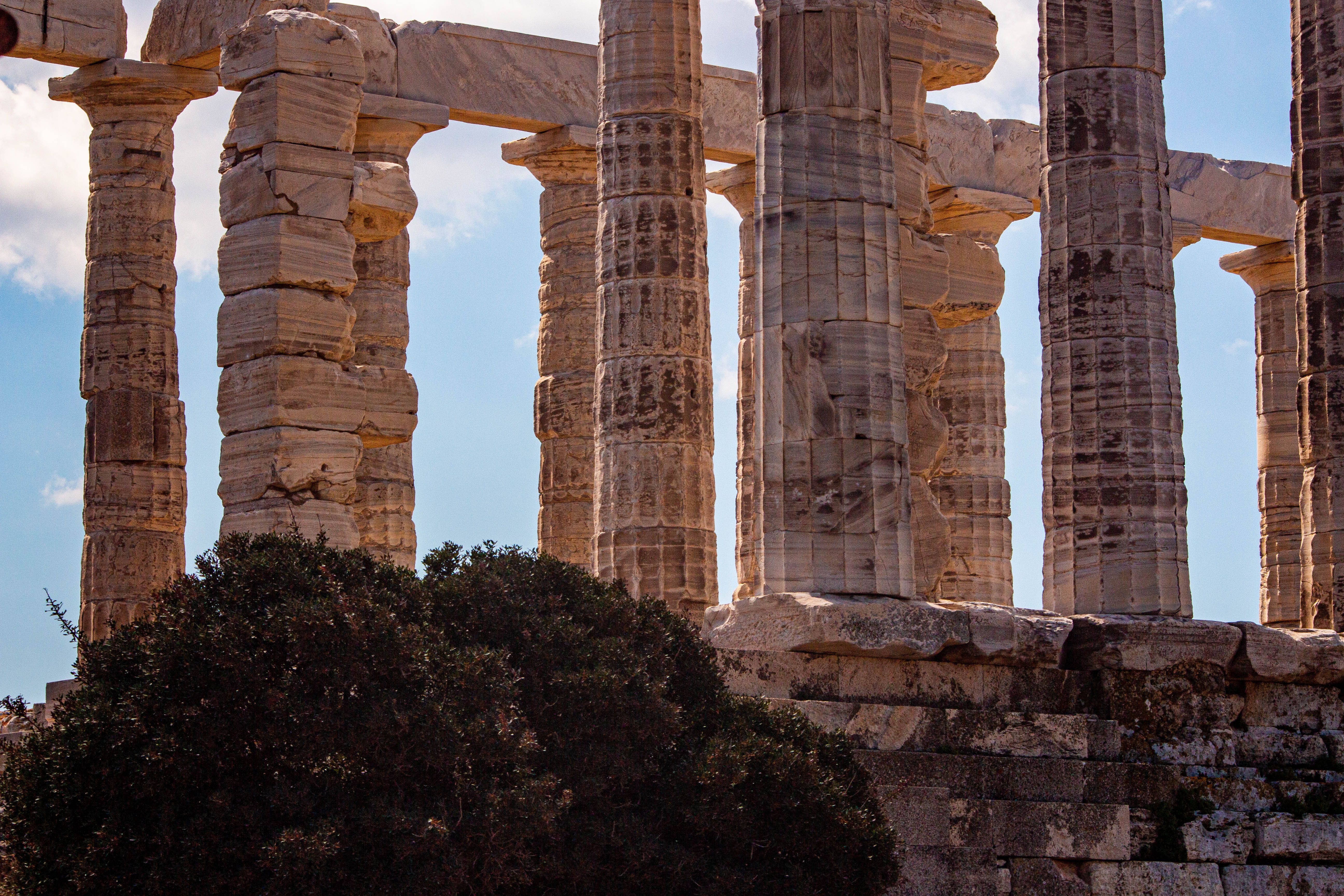 Ancient Greek Temple Columns under Blue Sky · Free Stock Photo