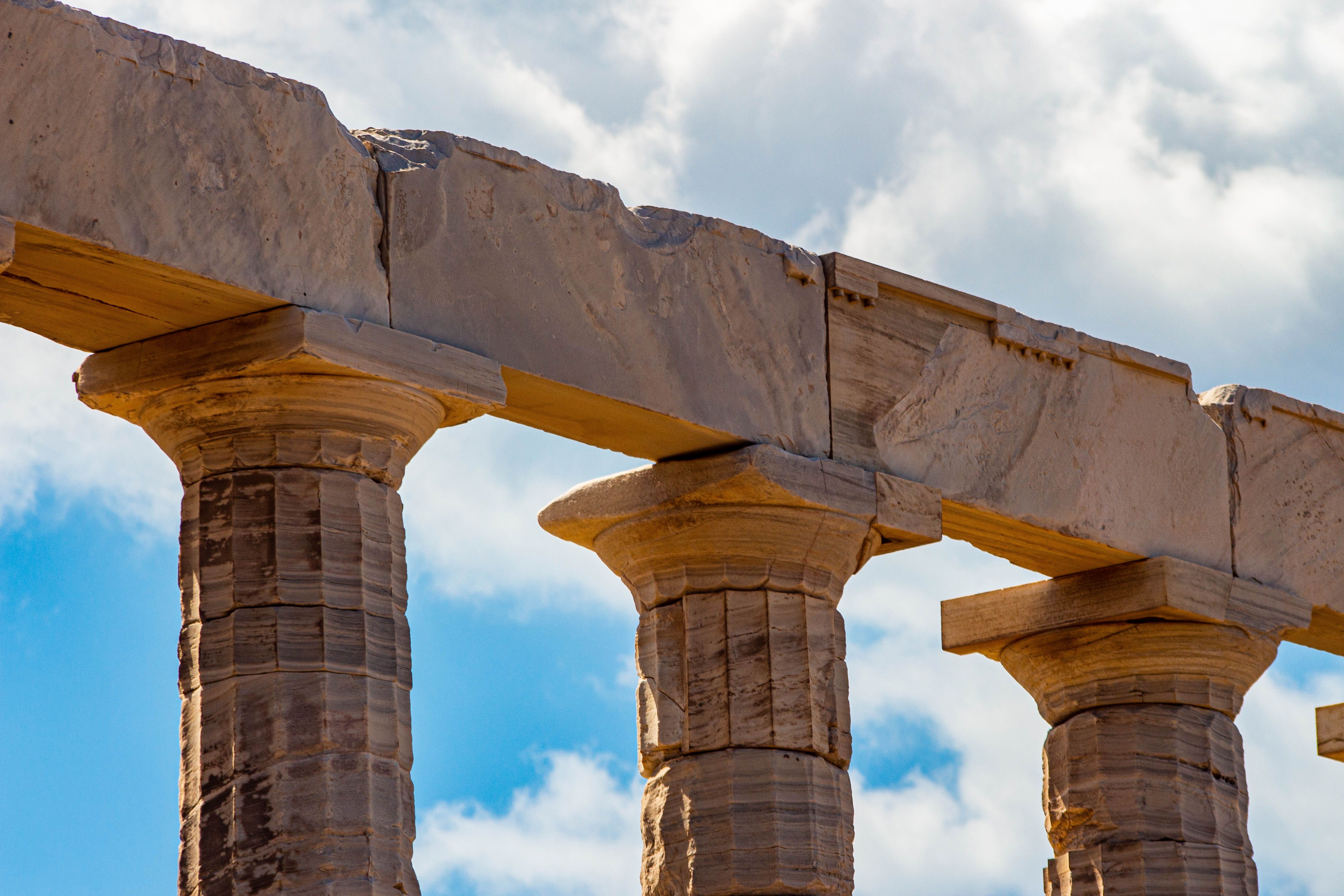 Ancient Greek Stone Columns Against Blue Sky · Free Stock Photo