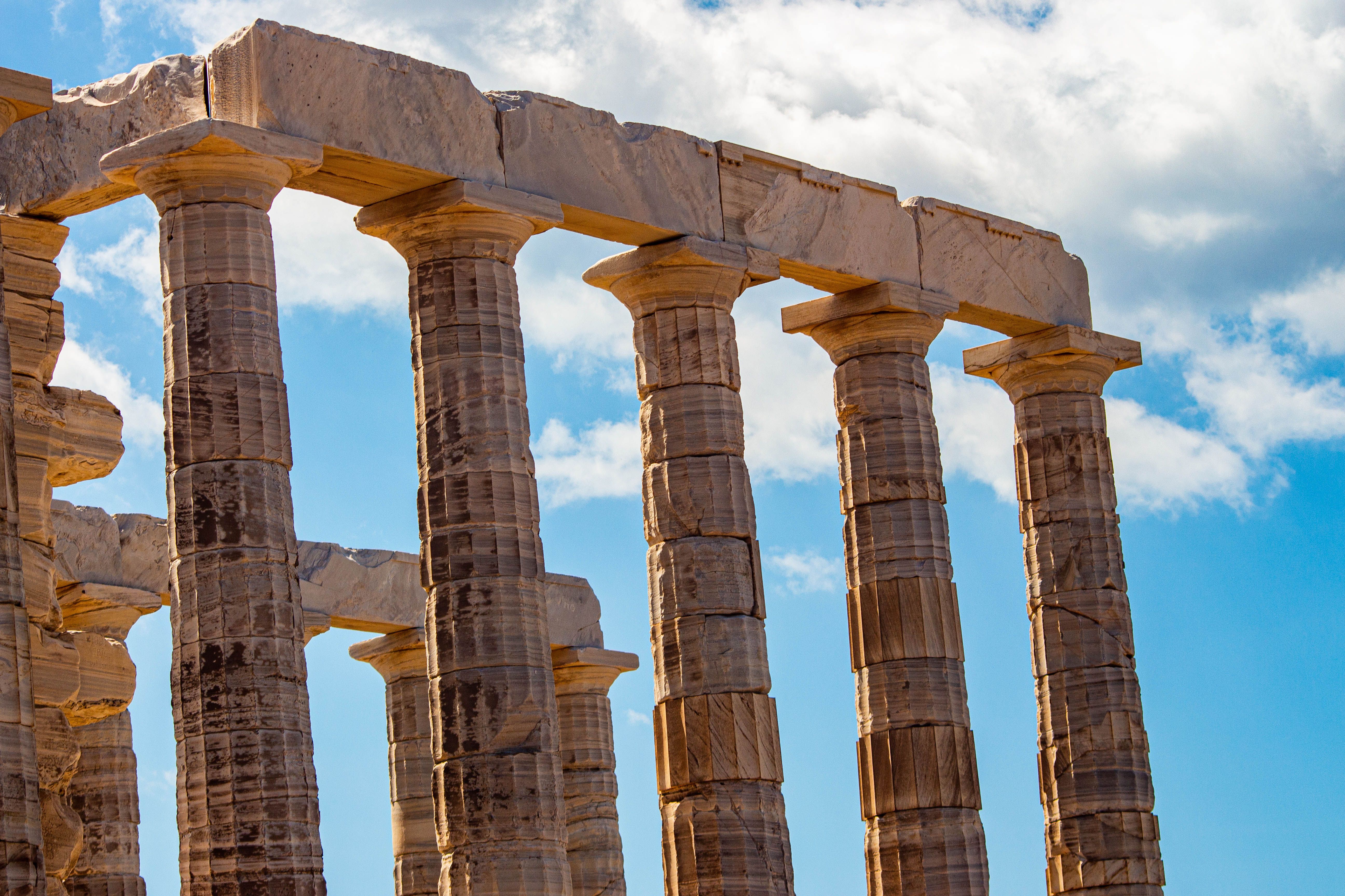 Ancient Greek Temple Columns Against Blue Sky · Free Stock Photo