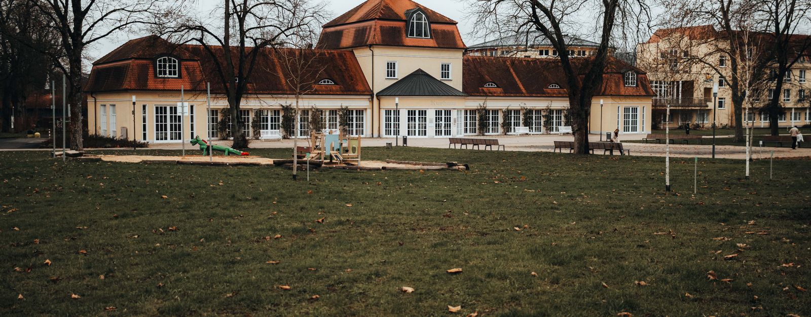 A historic building with unique architecture in Bad Hersfeld park, surrounded by bare trees in winter.