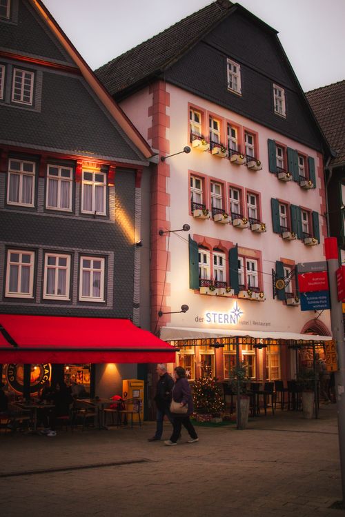 Free Explore the festive evening atmosphere at a Christmas market in Bad Hersfeld, Germany. Stock Photo