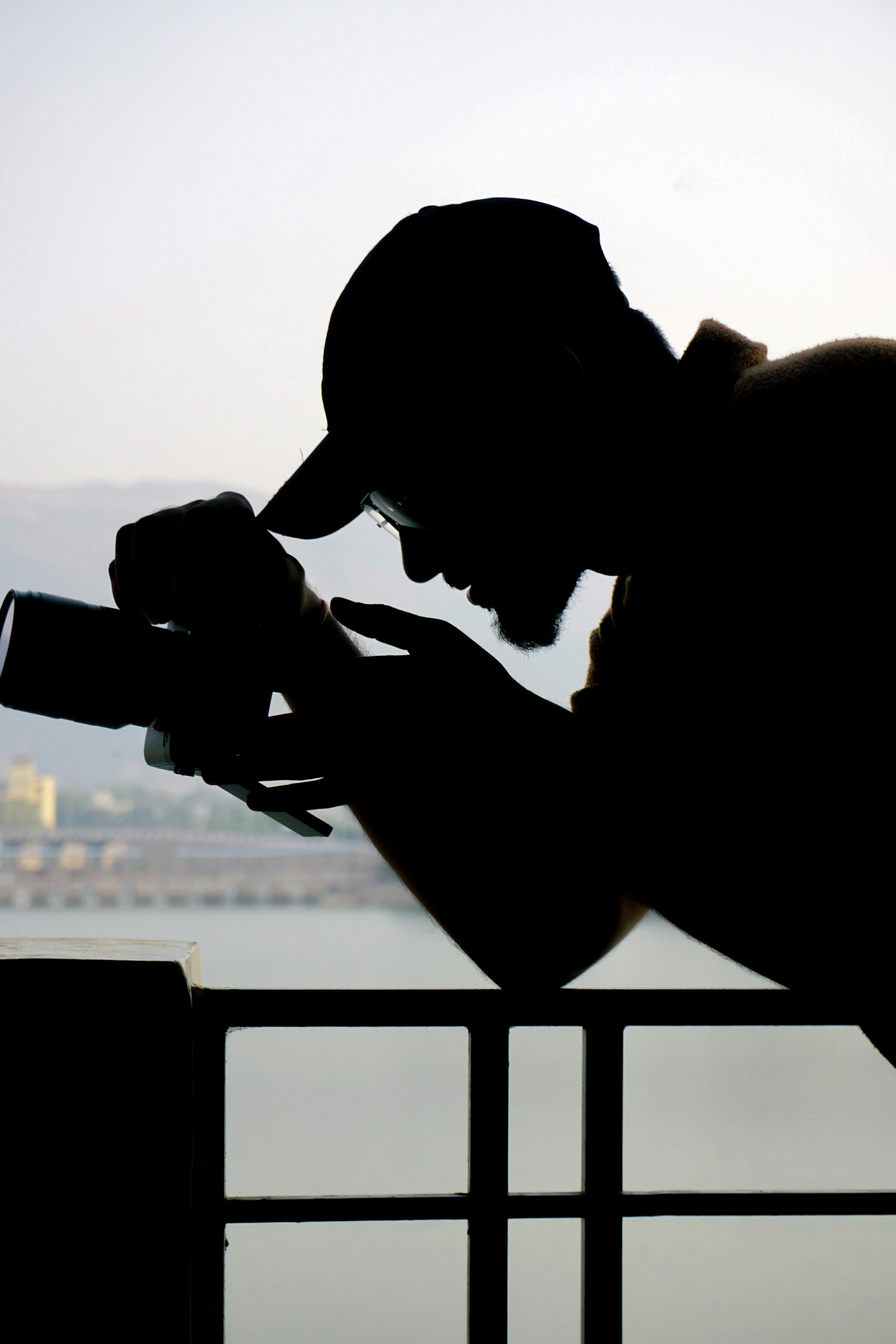 Miễn phí Hình bóng một nhiếp ảnh gia đang ghi lại khung cảnh tuyệt đẹp của thành phố Ajmer, Rajasthan, Ấn Độ. Ảnh lưu trữ