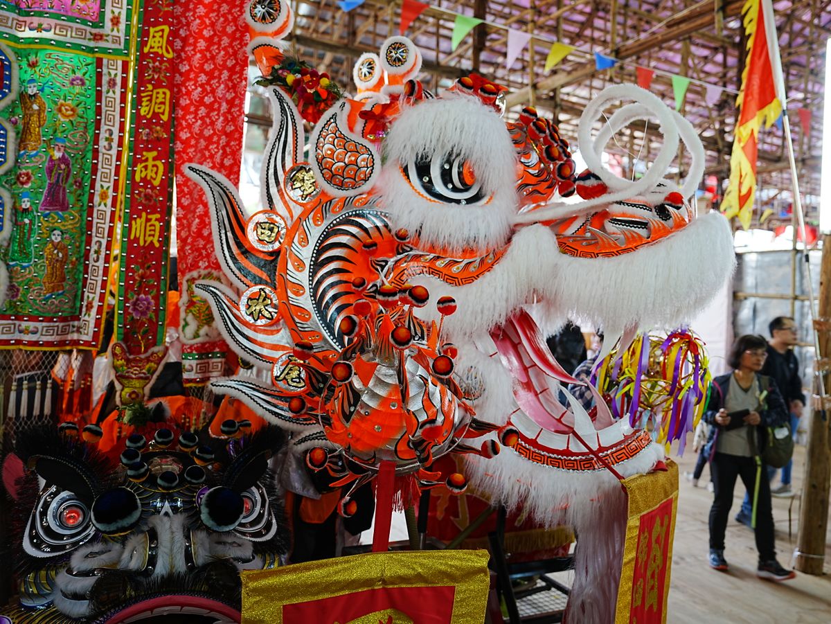 Vibrant dragon dance costume at a traditional festival