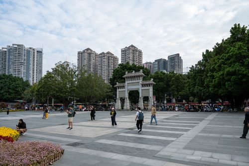 Free Street view in Guangzhou city featuring a traditional gate and modern skyscrapers. Stock Photo