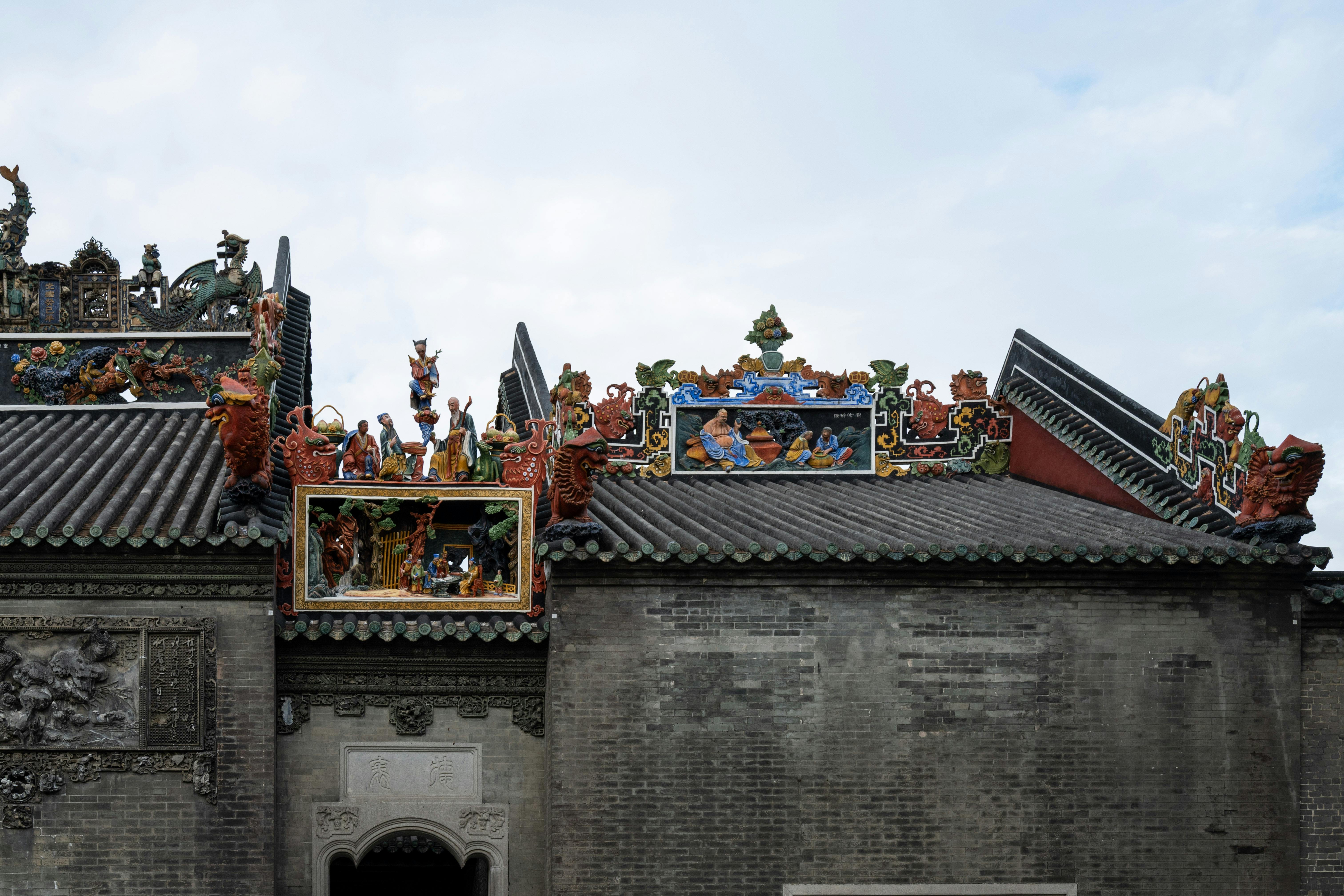 Vibrant art decorates the rooftop of Guangzhou's historic Chen Clan Ancestral Hall. - Guangzhou