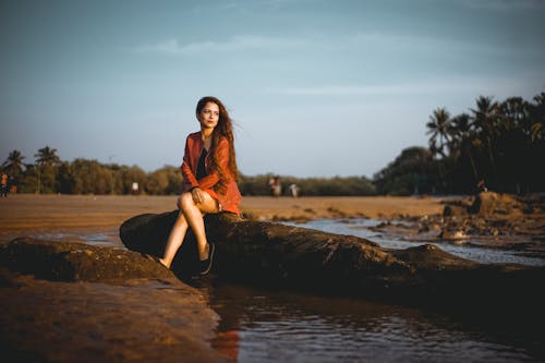 Shallow Focus Photo of Woman in Orange Long-sleeved Dress