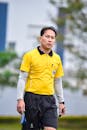Football Referee in Action on Field, Vietnam