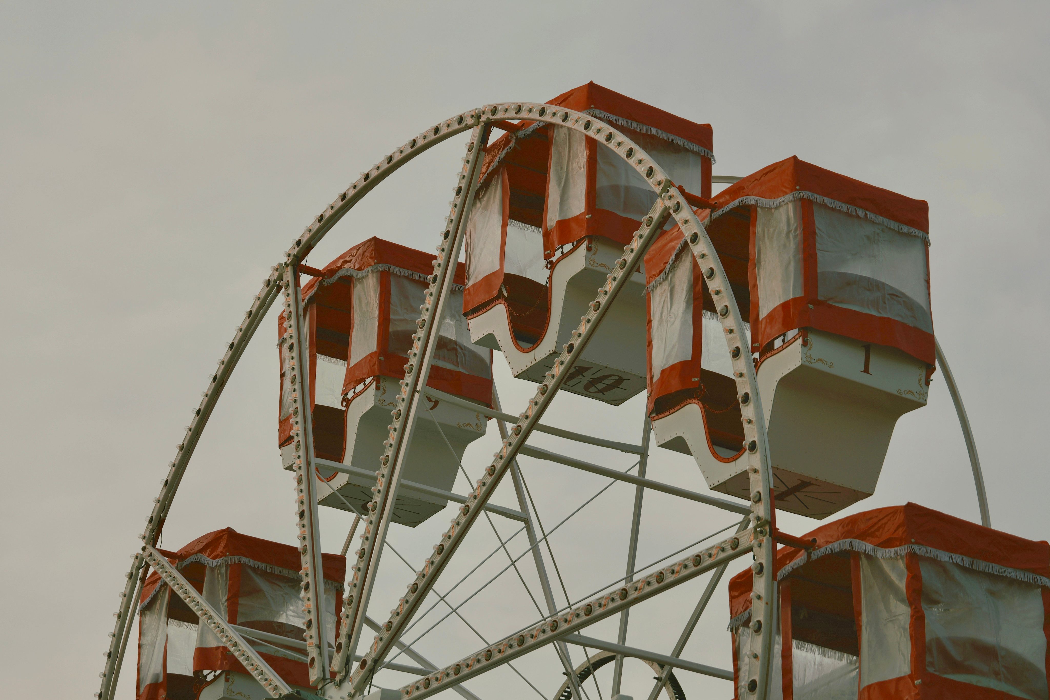 Vintage Ferris Wheel Against Cloudy Sky · Free Stock Photo