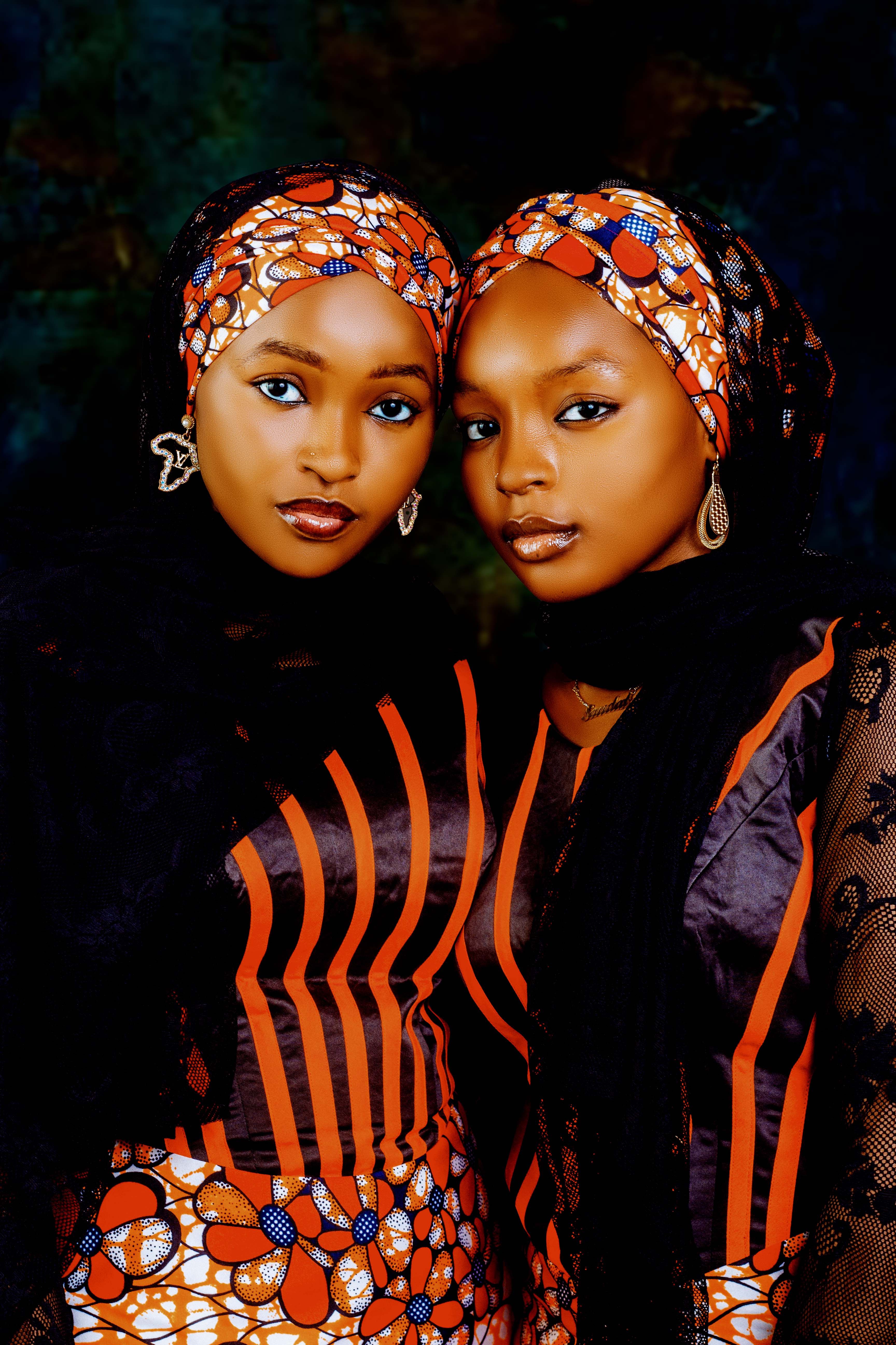 Elegant Portrait of Two Women in Traditional Attire · Free Stock Photo