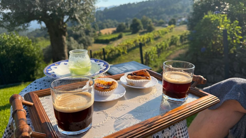Delicious Pastel de Nata pastries on a plate in a Portuguese cafe