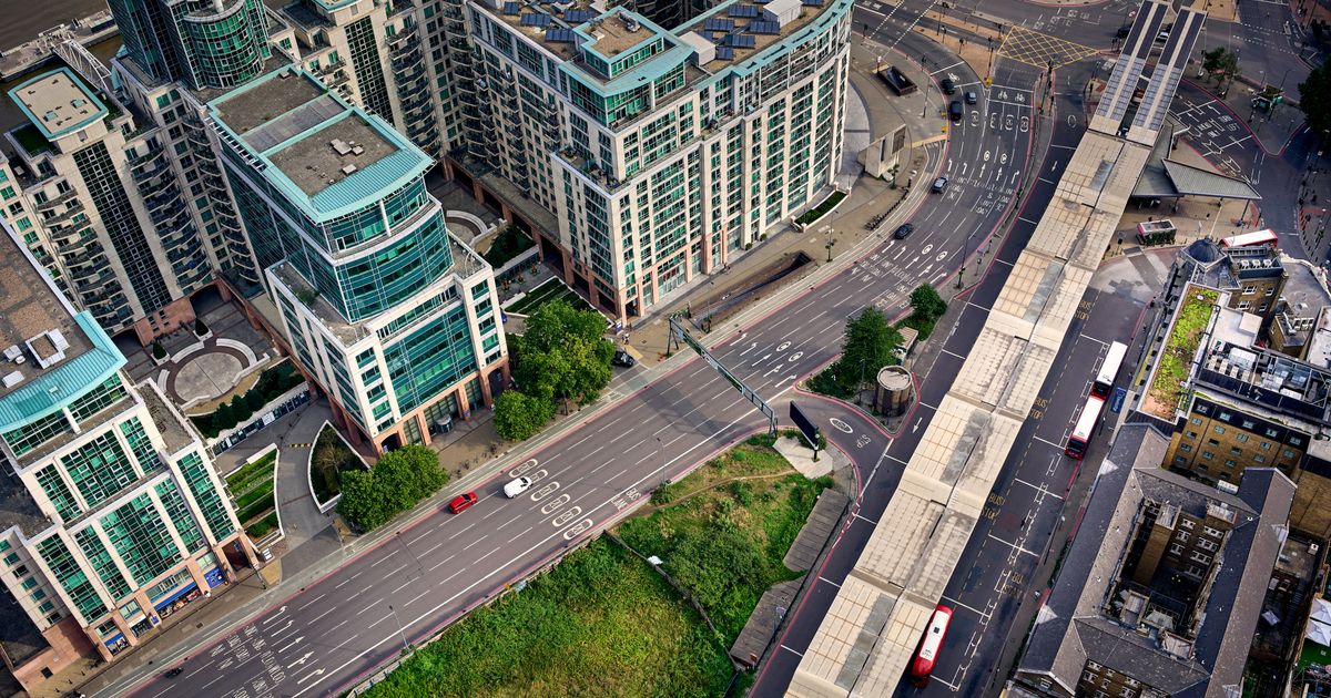 How No Win No Fee Solicitors Work in UK Road Traffic Claims — Aerial view of contemporary buildings and roads showcasing modern urban architecture in London.