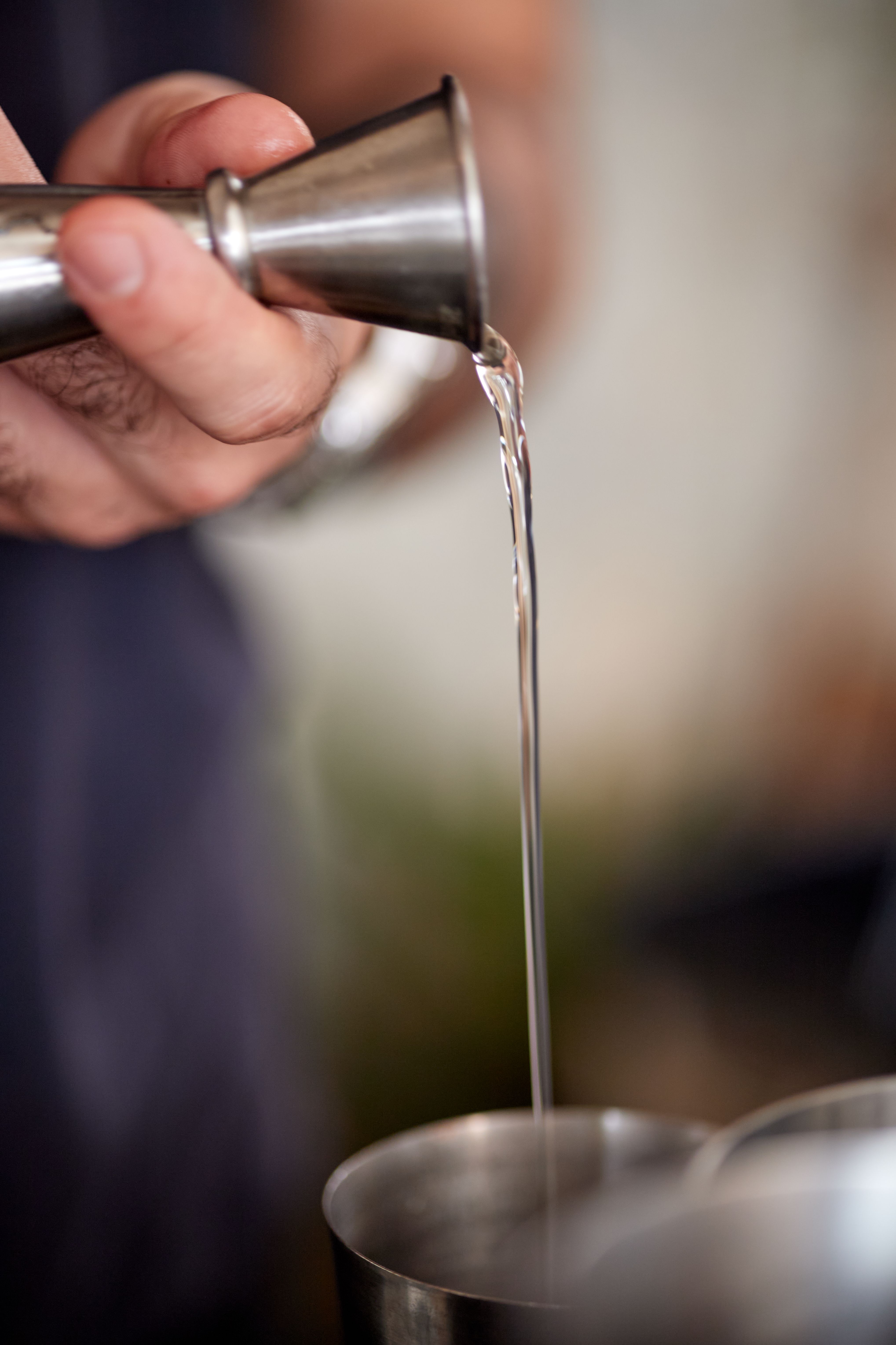 Close-up of Bartender Using a Jigger for Cocktail · Free Stock Photo