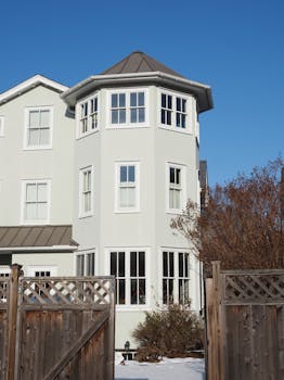 A charming three-story house in Doylestown, Pennsylvania, bathed in winter sunlight.