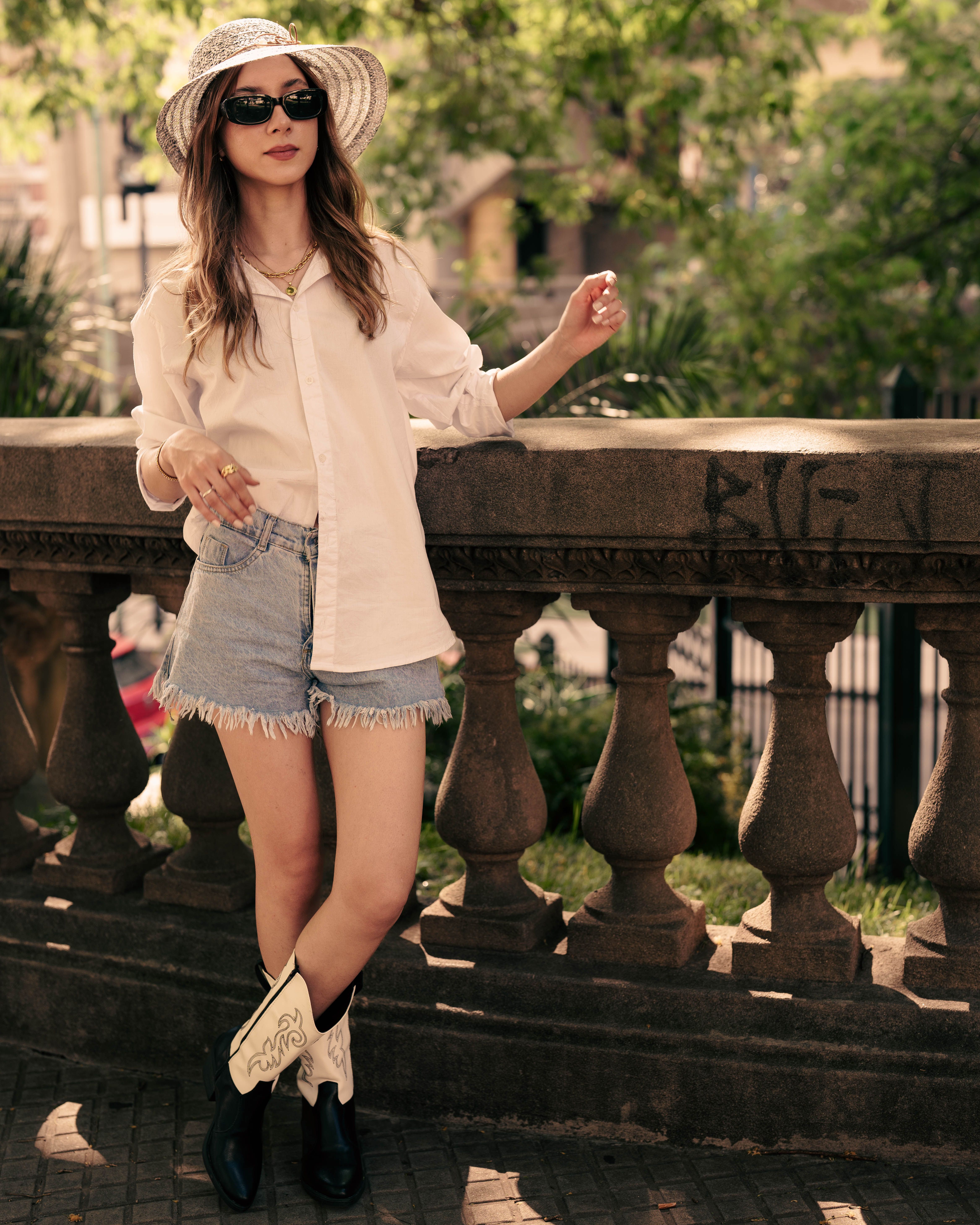 Stylish Woman Posing Outdoors in Summer Attire · Free Stock Photo
