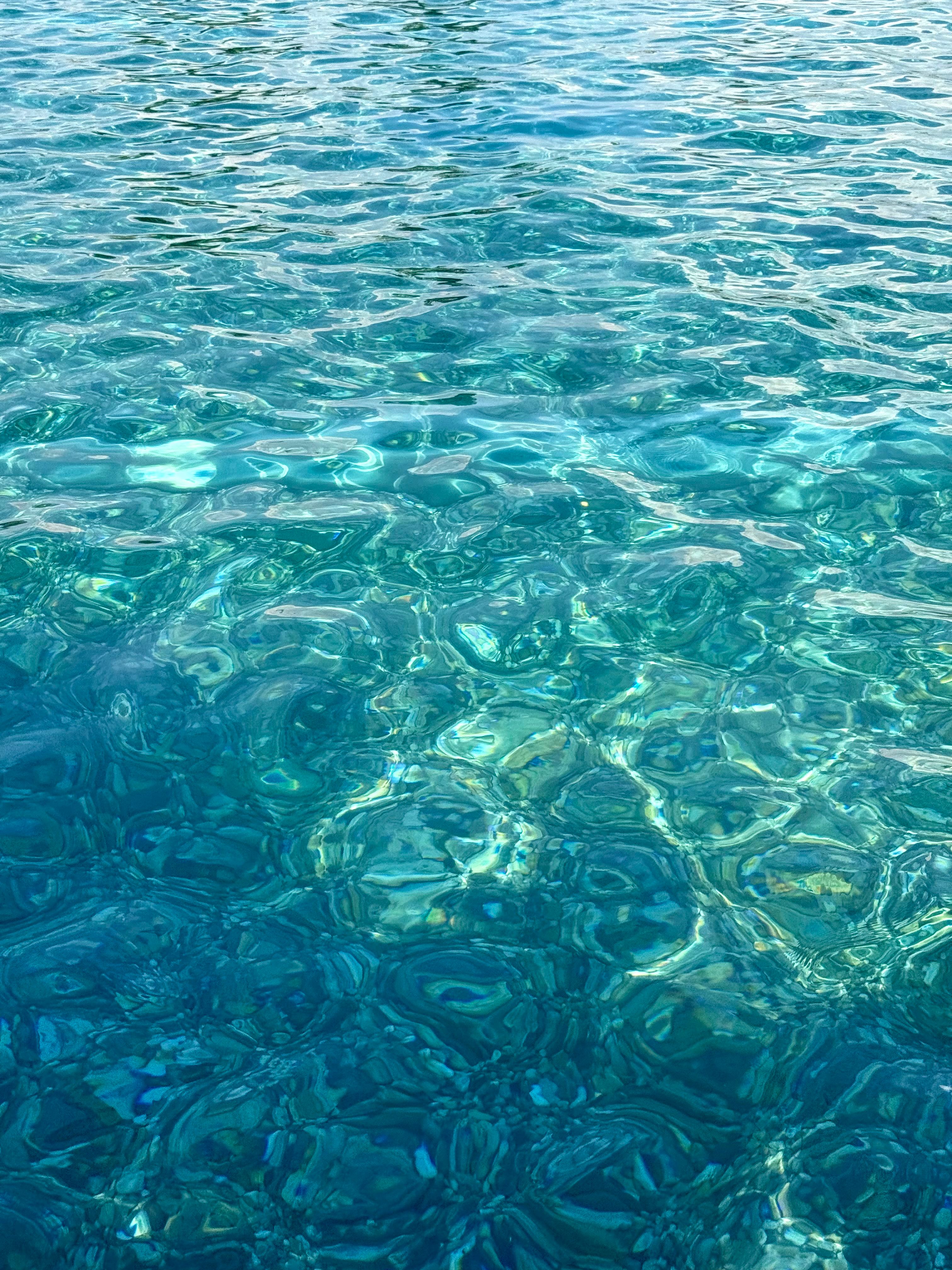 Vibrant image of azure ocean water ripples in Croatia, capturing tranquil beauty.