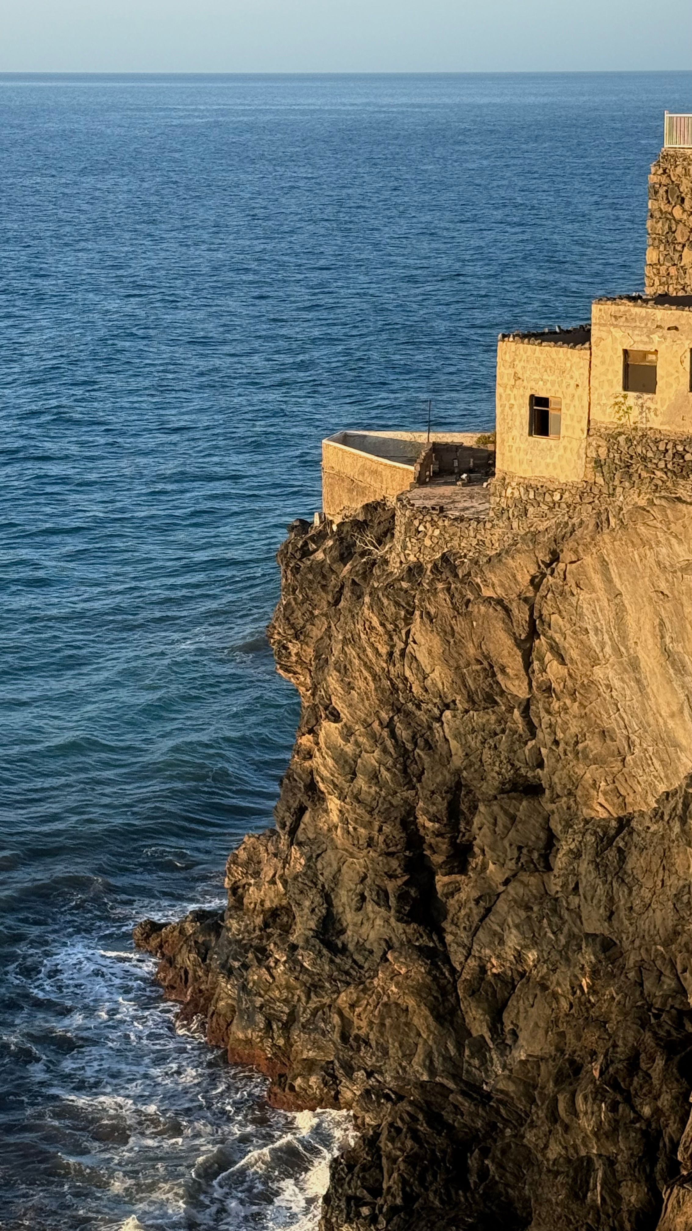 Historic Coastal Building on Rocky Cliff in Spain · Free Stock Photo
