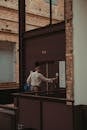 Man Standing Beside Elevator Door