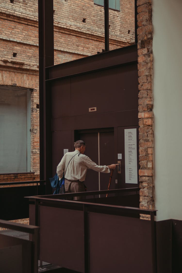 Man Standing Beside Elevator Door