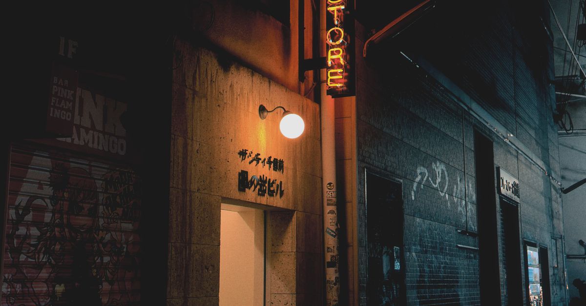Neon Storefront in Urban Alley at Night · Free Stock Photo
