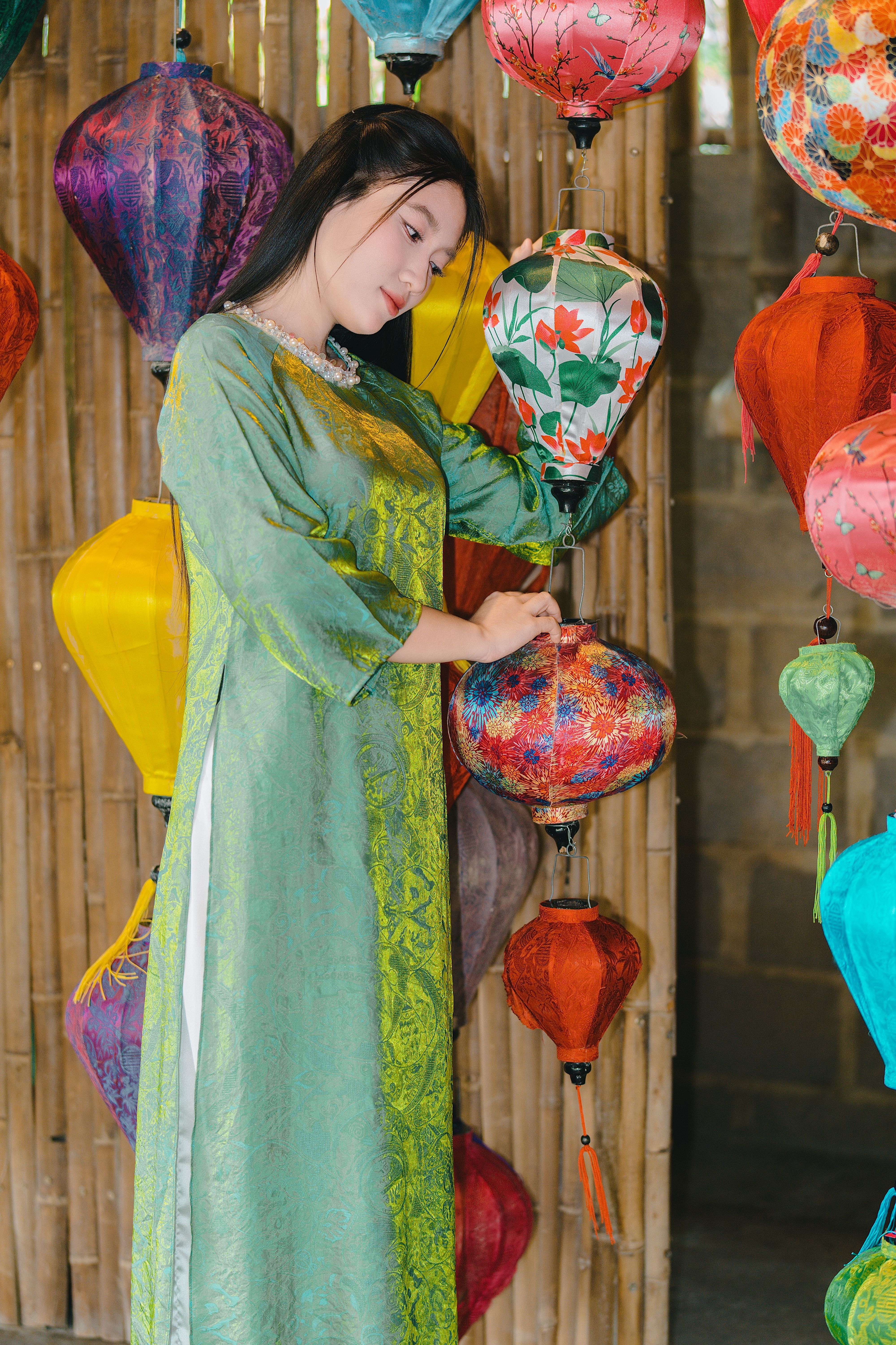 Woman in Traditional Dress Admires Colorful Lanterns · Free Stock Photo