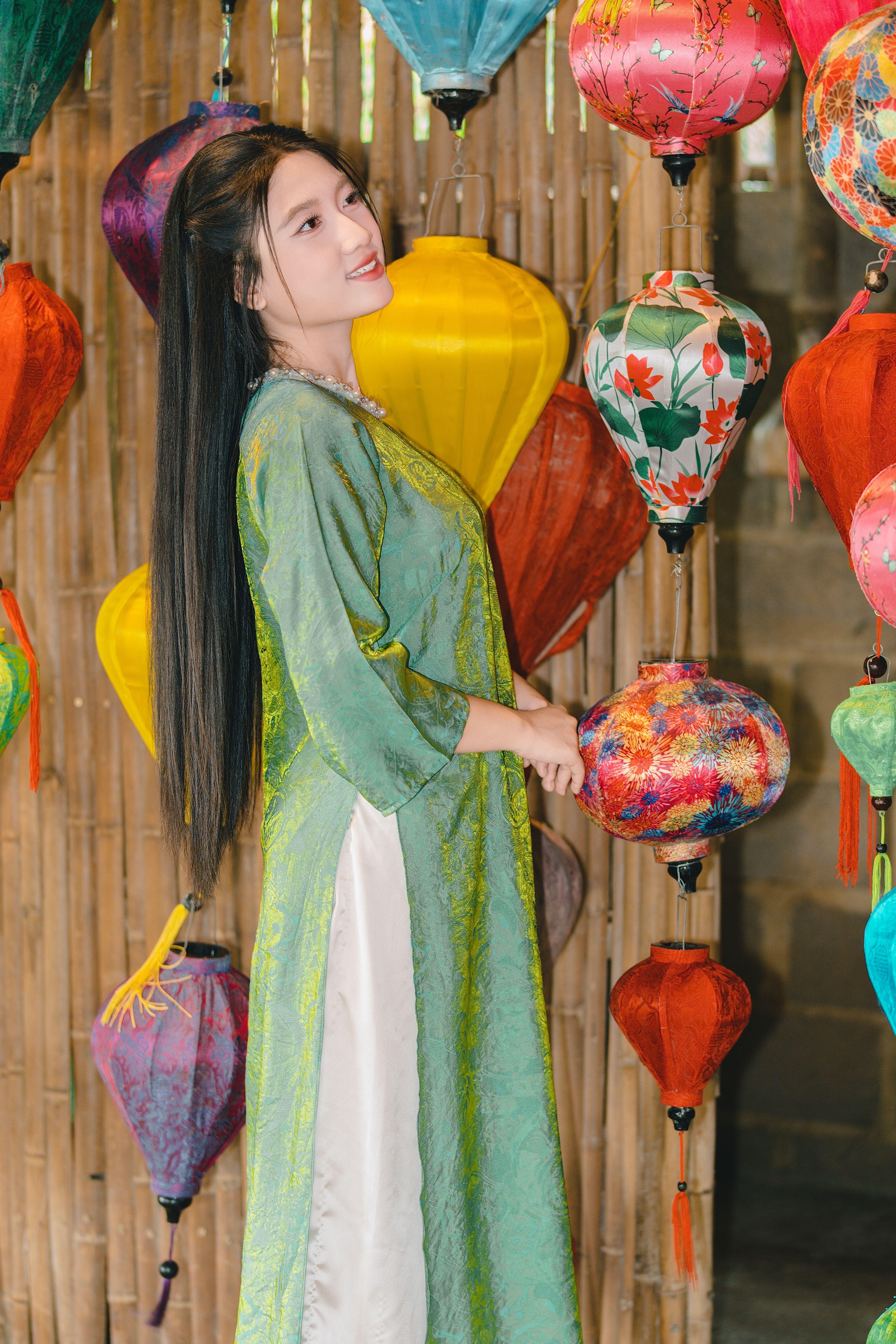 Woman in Traditional Dress with Colorful Lanterns · Free Stock Photo