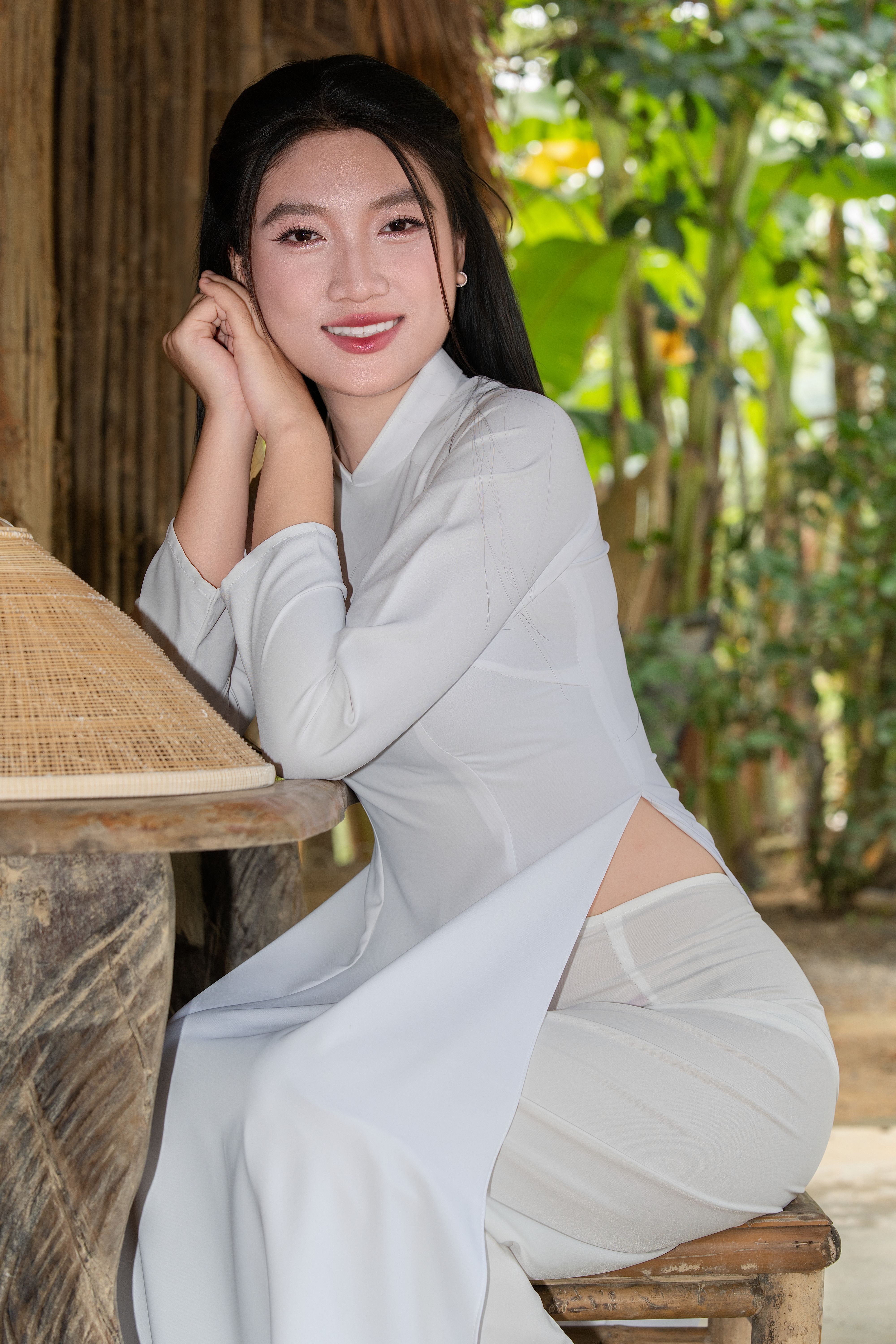Smiling Woman in Traditional White Dress Outdoors · Free Stock Photo