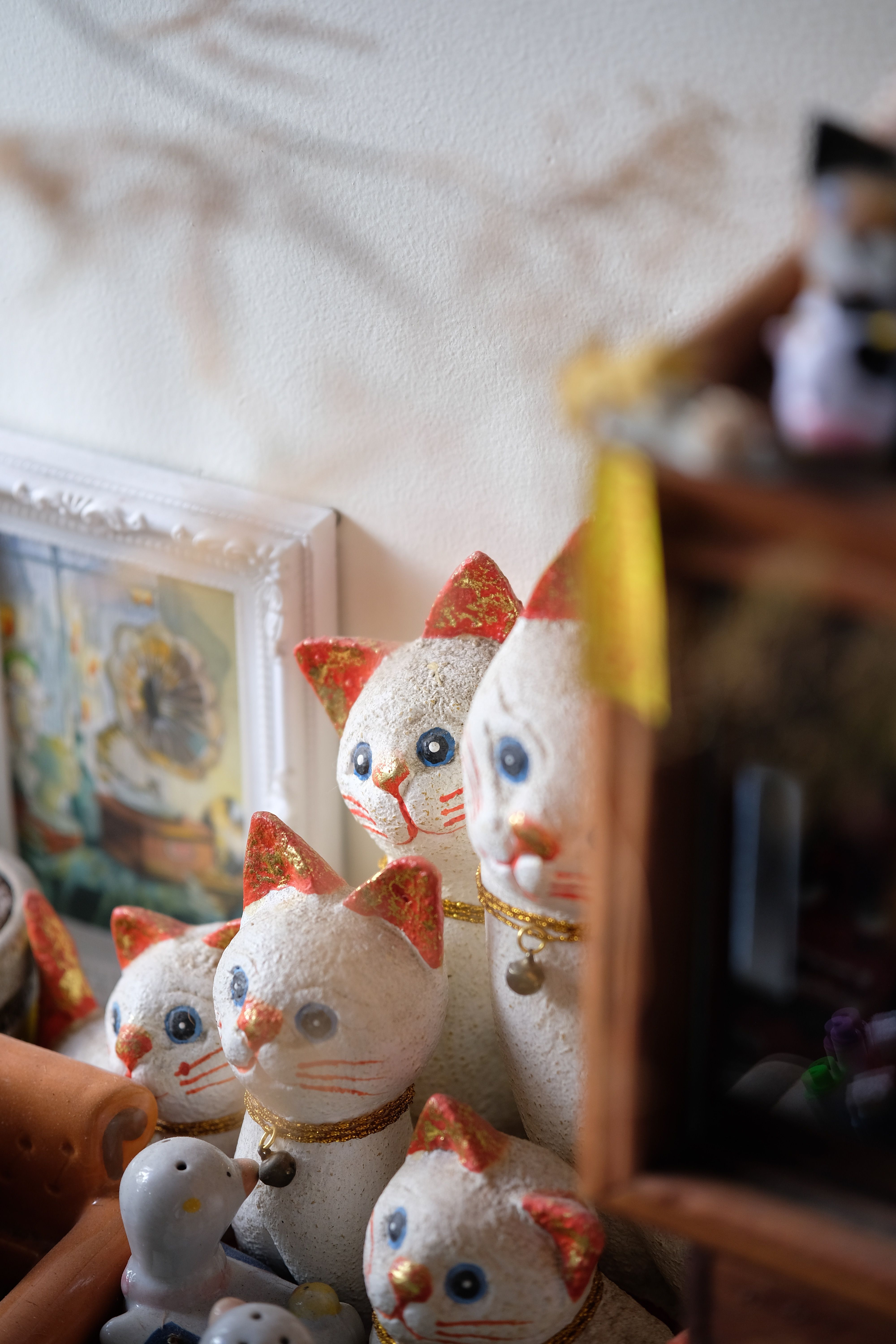 Charming Maneki Neko Cat Figurines in Display · Free Stock Photo
