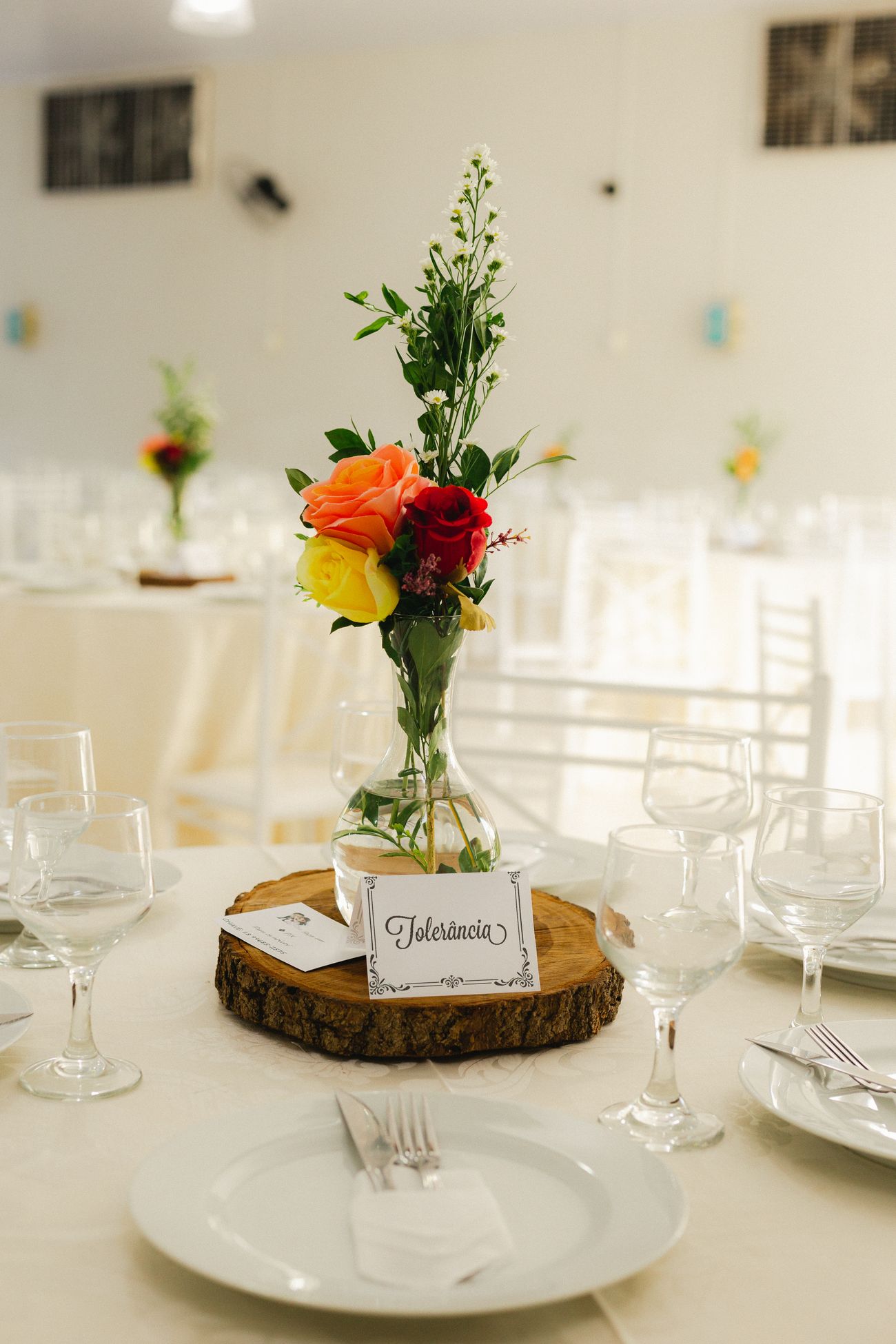 Elegant place settings with flowers arranged for a wedding celebration