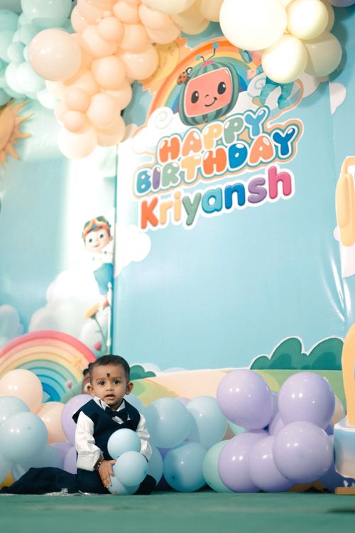 Free A joyful first birthday party with decorations and smiling baby boy. Stock Photo