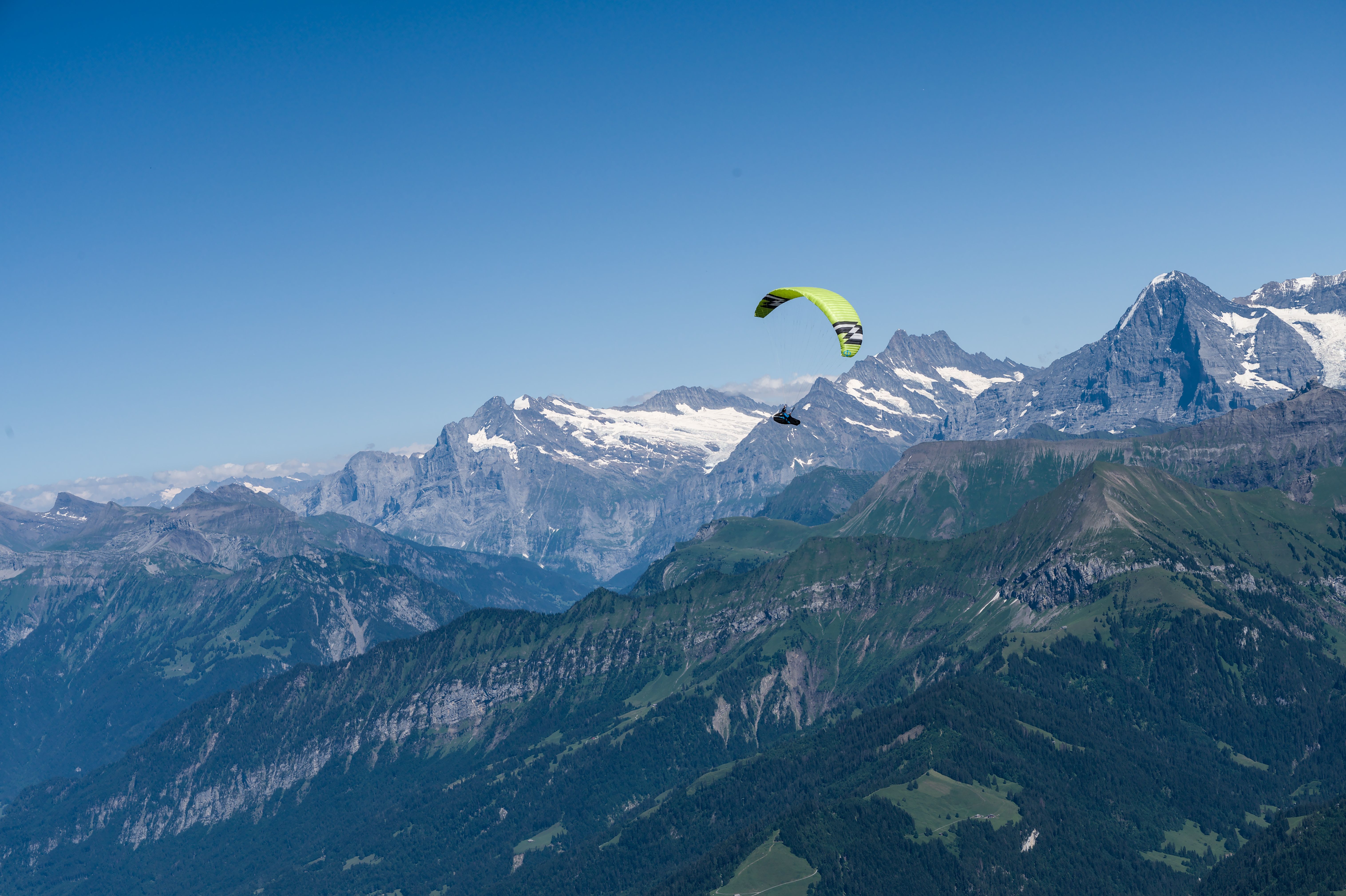 interlaken switzerland paragliding tandem flight alps two lakes jungfrau mountains aerial